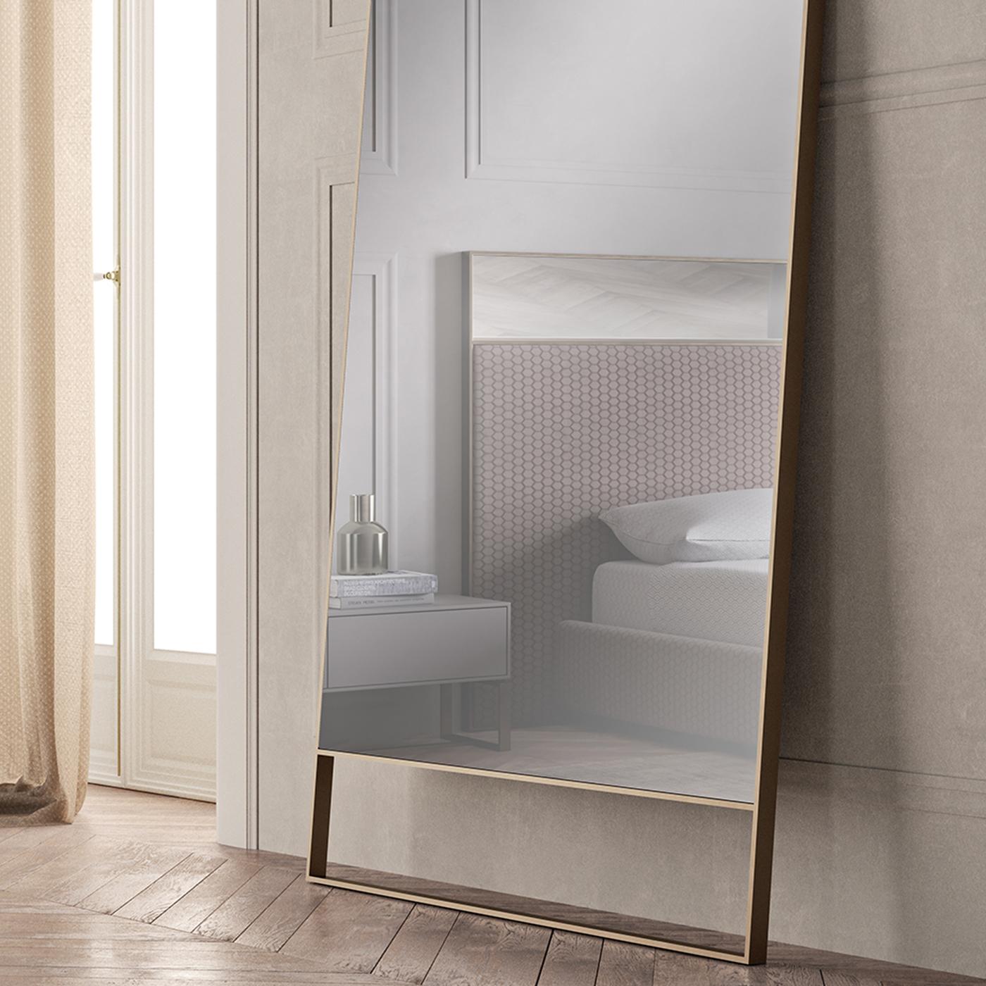 Smart solution for opening up a space, this elegant mirror will shine in modern residential and professional decors. The streamlined frame in satin-finished, lacquered stainless steel with components in poplar and birch plywood provides a rich,