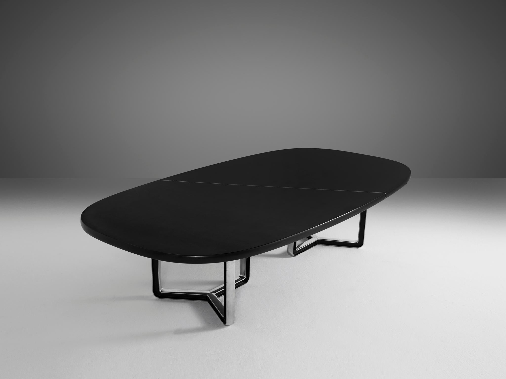 Tecno Design Centre for Tecno, conference table 335a, black lacquered wood, aluminum, Italy, 1975-1978

Large conference table with a black top. The table is composed of two parts that are connected via a white line. The tabletop rests on two