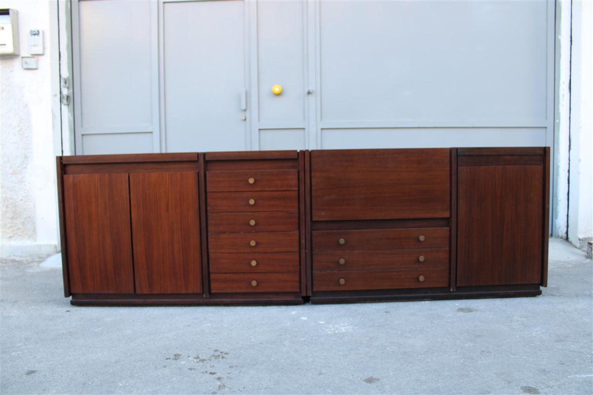 Tecno Minimalist modular sideboard Osvalbo Borsani 1960s mahogany Italian design.

They have doors, drawers, tray, and bar cabinet, a combination of elements that make it very useful.