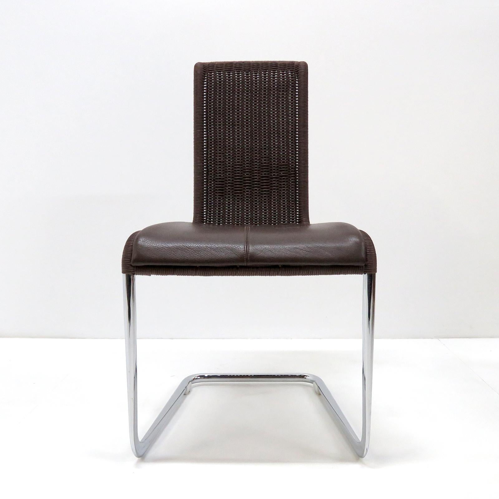 Wonderful high back cantilever chairs B45 by Tecta, 1981 in dark brown wickerwork and detachable brown leather seating pads on a 'tube aplati' chrome plated steel frame. 'Tube aplati' is a steel tube flattening technique that was first used by Jean