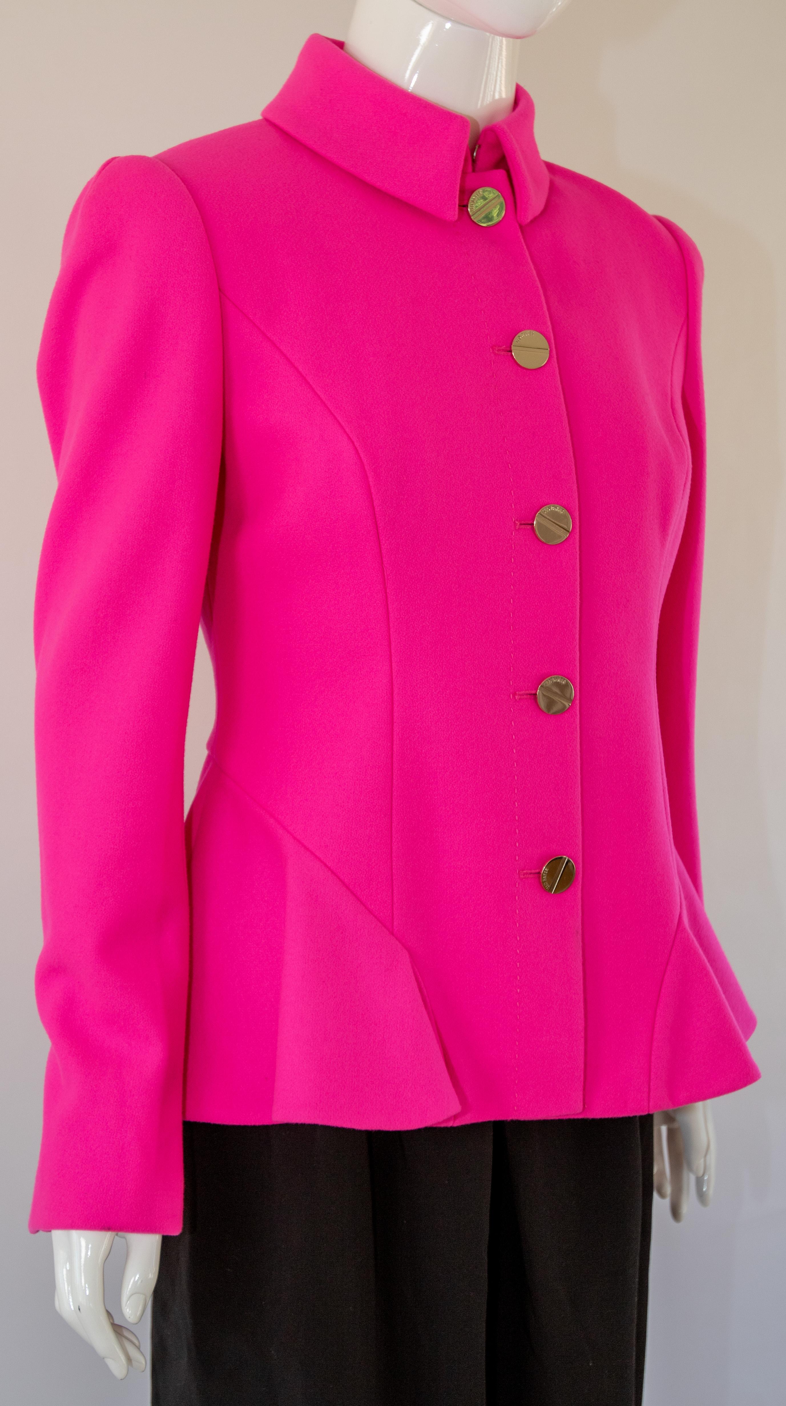 
Step out in a pop of color with this hot pink peplum jacket from Ted Baker.
A short wool-blend coat with peplum waist detail and a high neck collar. 
Featuring Ted Baker branded gold buttons and a floral printed lining for added comfort and