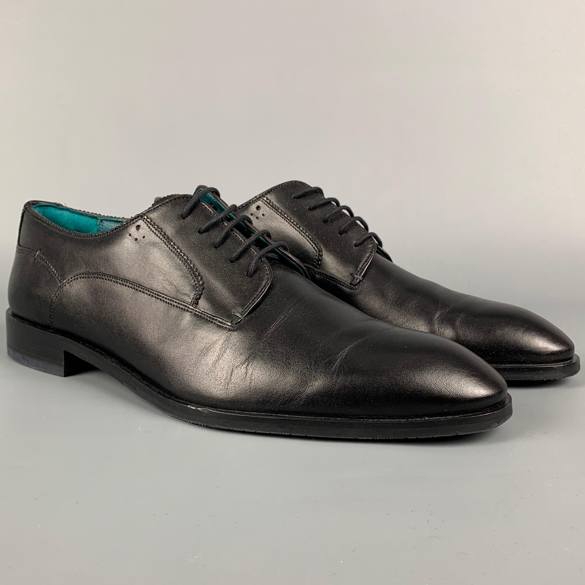 TED BAKER shoes comes in a black leather featuring a cap toe and a lace up closure. 

Very Good Pre-Owned Condition.
Marked: 12

Outsole: 12.5 in. x 4.25 in. 