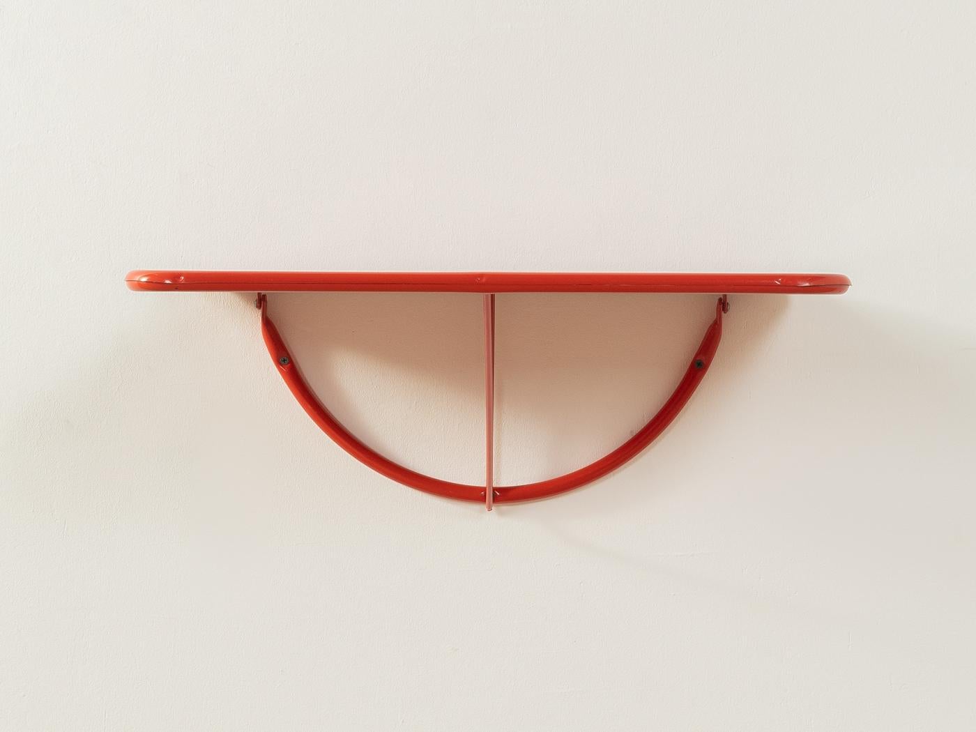 Very rare TED folding table by Niels Gammelgaard for IKEA from the 1980s. Frame and table top made of red lacquered metal. Easy wall mounting with three screws.

Quality Features:

    very good workmanship
    high-quality materials
    Made in