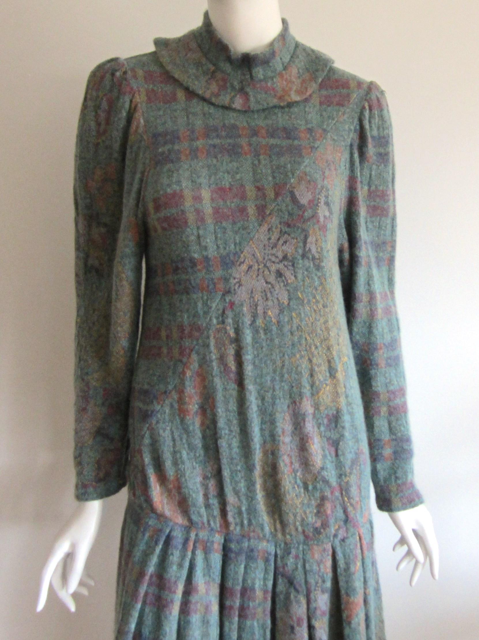Lovely Wool blend Ted Lapidus Multi Colored (what feels like a wool / mohair blend) Dress. Has a madarin style collar with a drop skirt. Floral and check design. Measuring (labeled a 36) Up to 34 in. bust - Up to 34 in waist - up to 36 in hips - 44