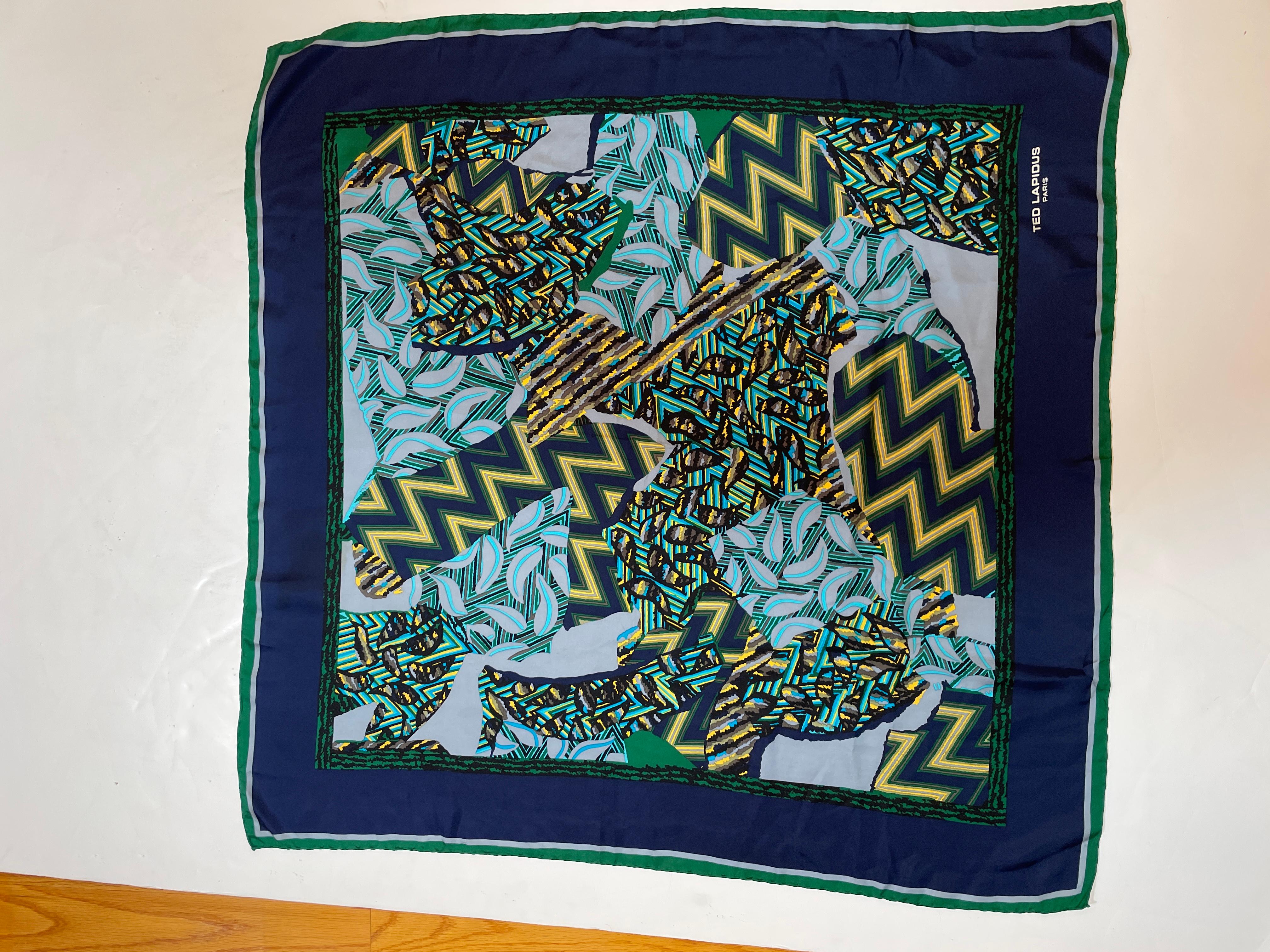 Gorgeous Ted Lapidus silk vintage scarf in blue and emerald green tones with geometric designs and hand rolled edges.
Made in France Circa 1970’s.
Large size: 34.5 x 34.5 inches.
About: 
Edmond 