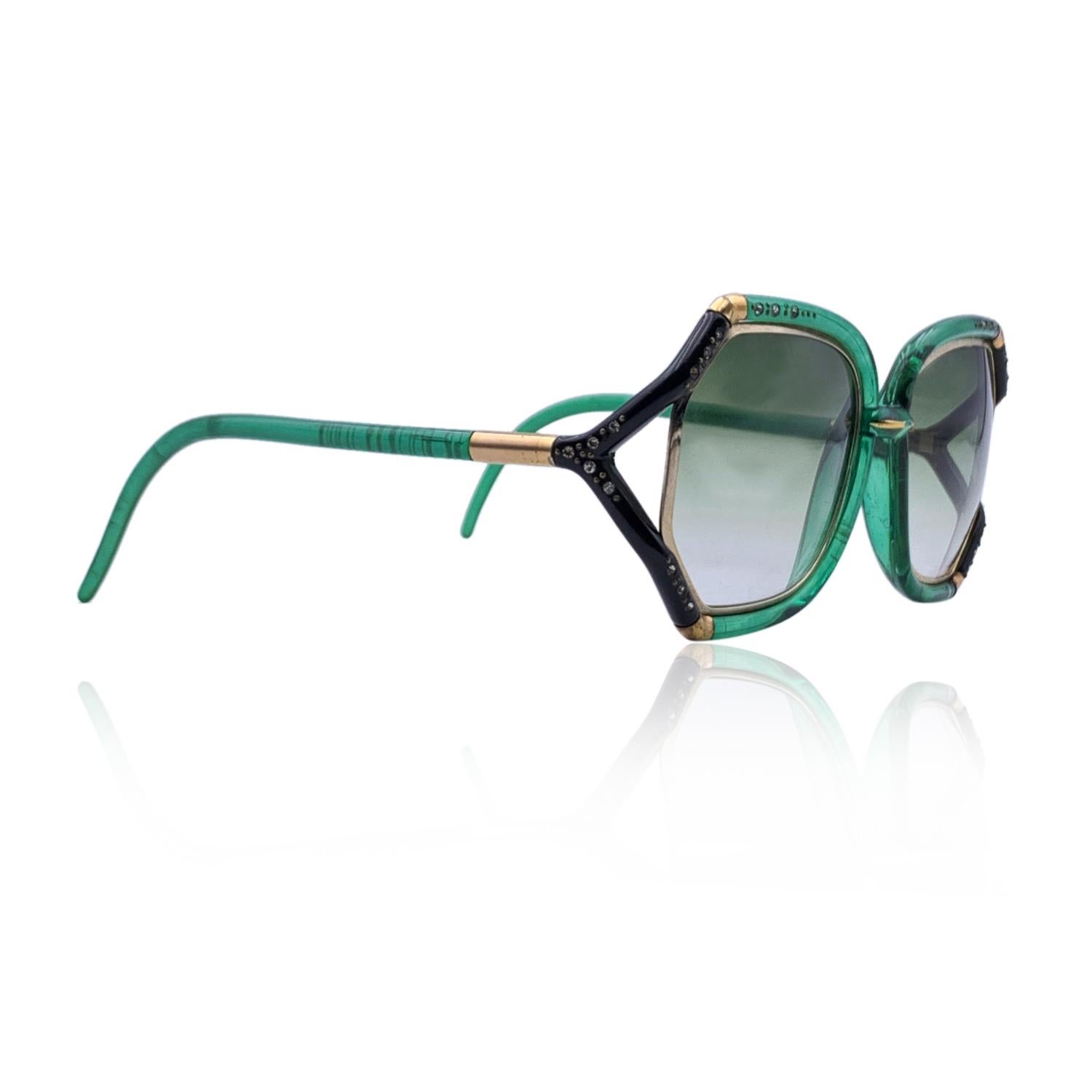Rare vintage TED LAPIDUS oversized sunglasses mod. TL10. Made in France. Cut-out bicolor green and black frame, with gold metal finish. Crystals embellishment on the front. Green gradient lenses. 100% UV protection. The same model was worn by