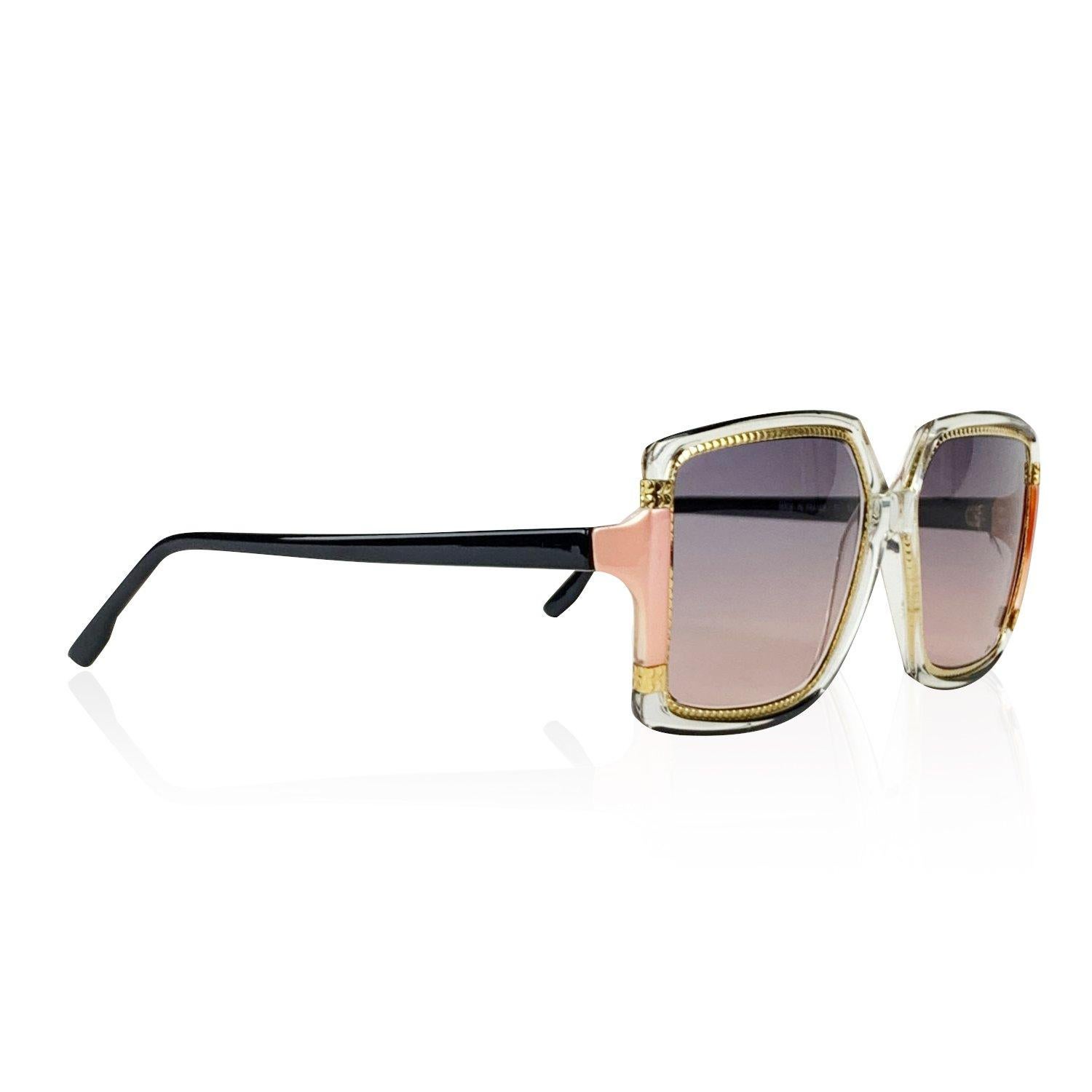 Rare vintage TED LAPIDUS oversized sunglasses mod. TL15 19. Clear oversize square frame with black and pink accents. Gold metal detailing. Purple gradient lenses (100% UV protection). Made in France. Details MATERIAL: Plastic COLOR: Clear MODEL: TL