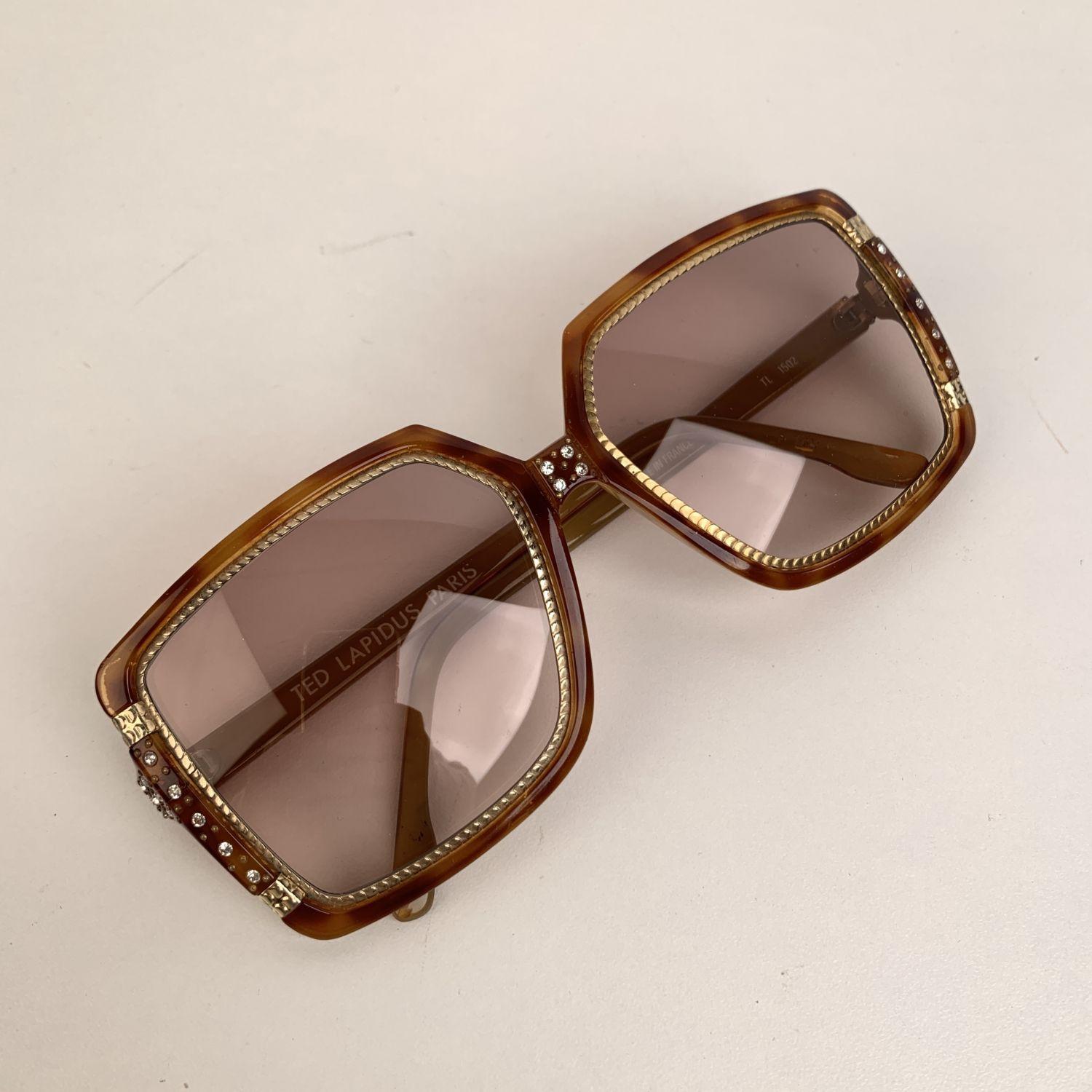 Rare vintage TED LAPIDUS oversized sunglasses mod. TL1502. Made in France. Brown oversized square tortoiseshell acetate frame with gold metal accents and crystal embellishment. Brown gradient lenses. 100% UV supreme quality
