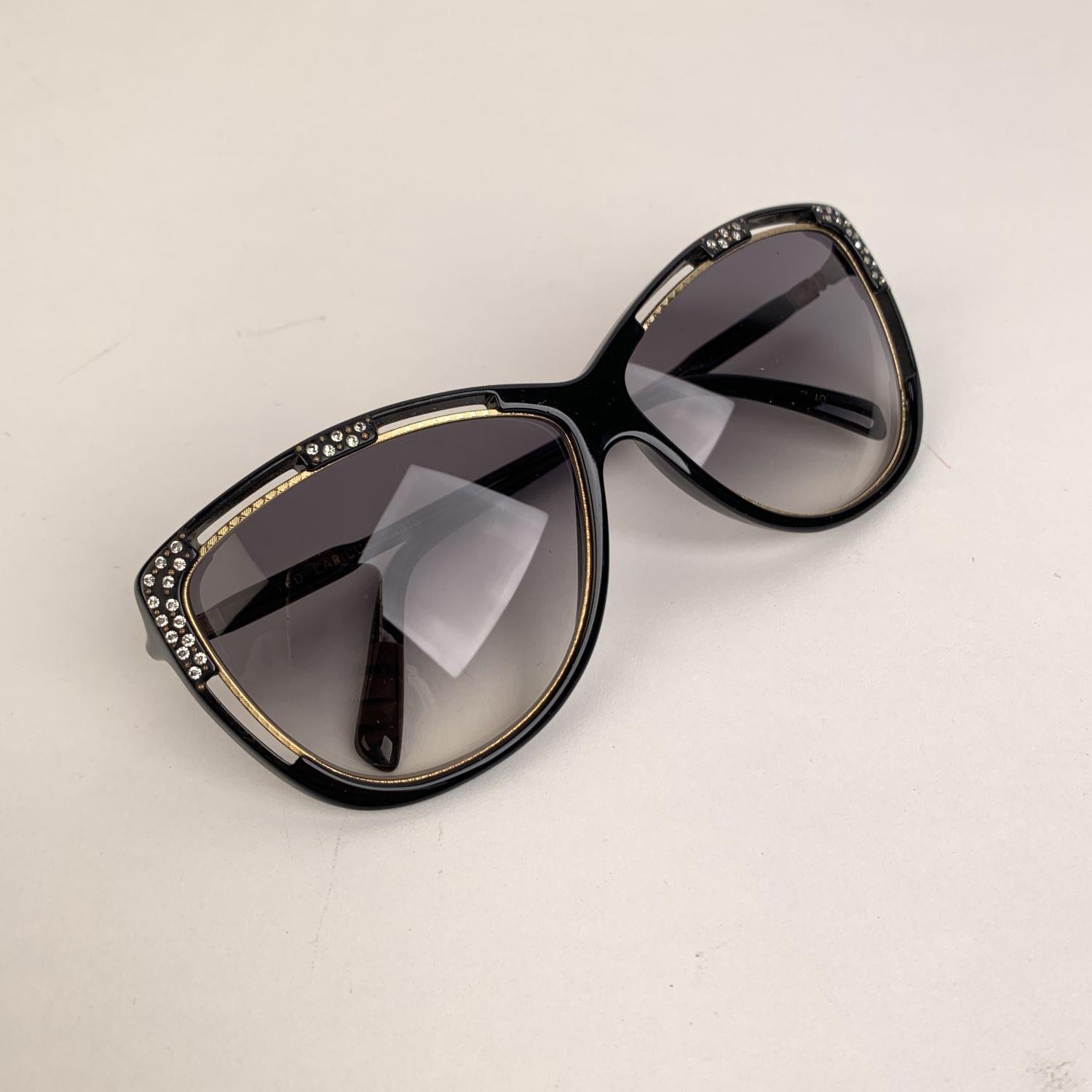 Rare vintage TED LAPIDUS oversized sunglasses mod. TL17 01, from the '90s. Made in France. Black oversized cat-eye acetate frame with gold metal accents and crystal embellishment. Gray gradient lenses. 100% UV supreme quality