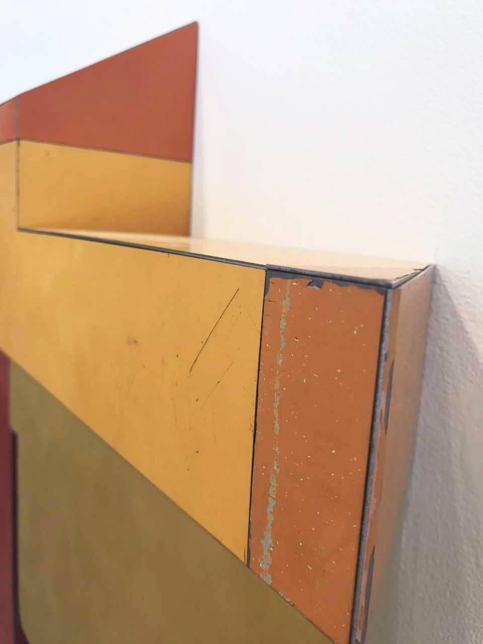 Ted Larsen's Random Logic is a hard-edged sculptural, mixed media painting. The work is primarily red, yellow, and orange in color. It is a graphic, architectural, minimalist three-dimensional painting. Constructivist, Bauhaus, abstract geometric,