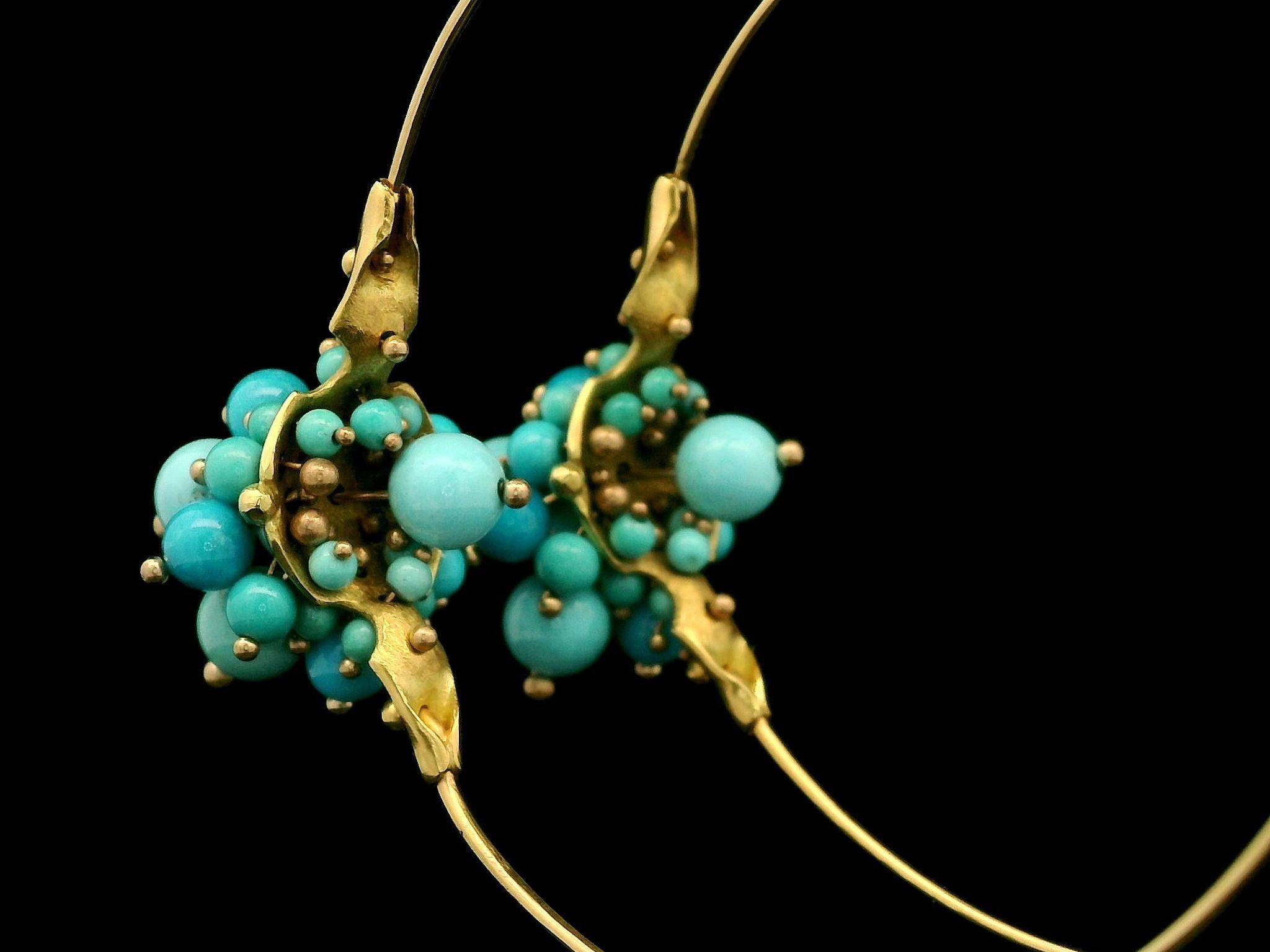 –Stone(s)–
Numerous Natural Genuine Turquoise - Bead Balls Shapes - Bezel Set - Natural Variation in Blue Color- Sleeping Beauty Turquoise 

Material: Solid 18k Yellow Gold w/ Plastic Stoppers
Weight: 11.35Grams
Backing: Wire Hook Closures (Pierced