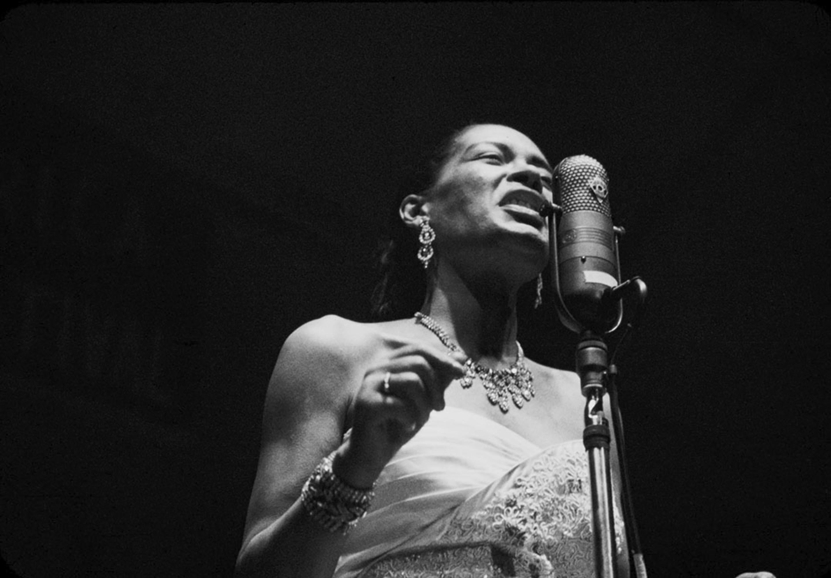 Estate-stamped, gelatin-print silver

American jazz musician and singer-songwriter Eleanora Fagan, professionally known as Billie Holiday, performing on stage.

Available sizes: 
16”x20" Edition of 25
20”x24" Edition of 25
30”x40" Edition of