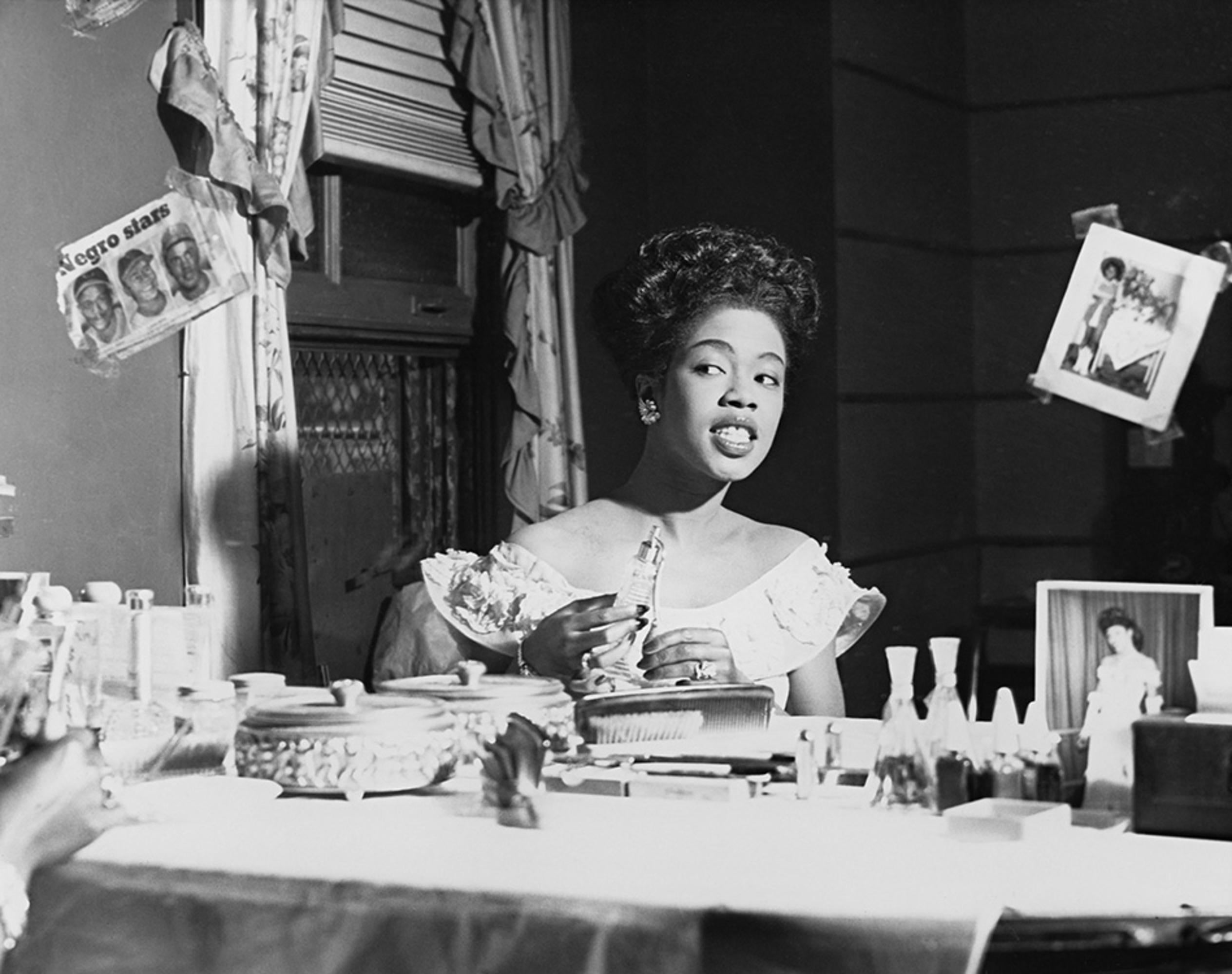 Estate-stamped, gelatin-print silver

A portrait of American jazz singer and Grammy Award winner, Sarah Vaughan in her dressing room at the Chicago theatre, IL, 1948.

Available sizes: 
16”x20" Edition of 25
20”x24" Edition of 25
30”x40" Edition of