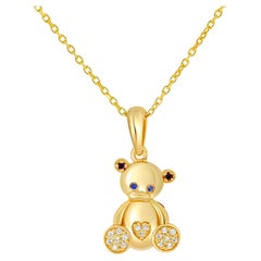 Teddy bear pendant in 14k gold.