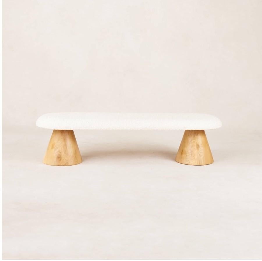 This whimsical piece from House of Léon is guaranteed to bring joy and warmth to any space. With tapered legs carved from solid blocks of white oak wood and white boucle upholstery, the Teddy Bench is the finishing touch your space has been waiting