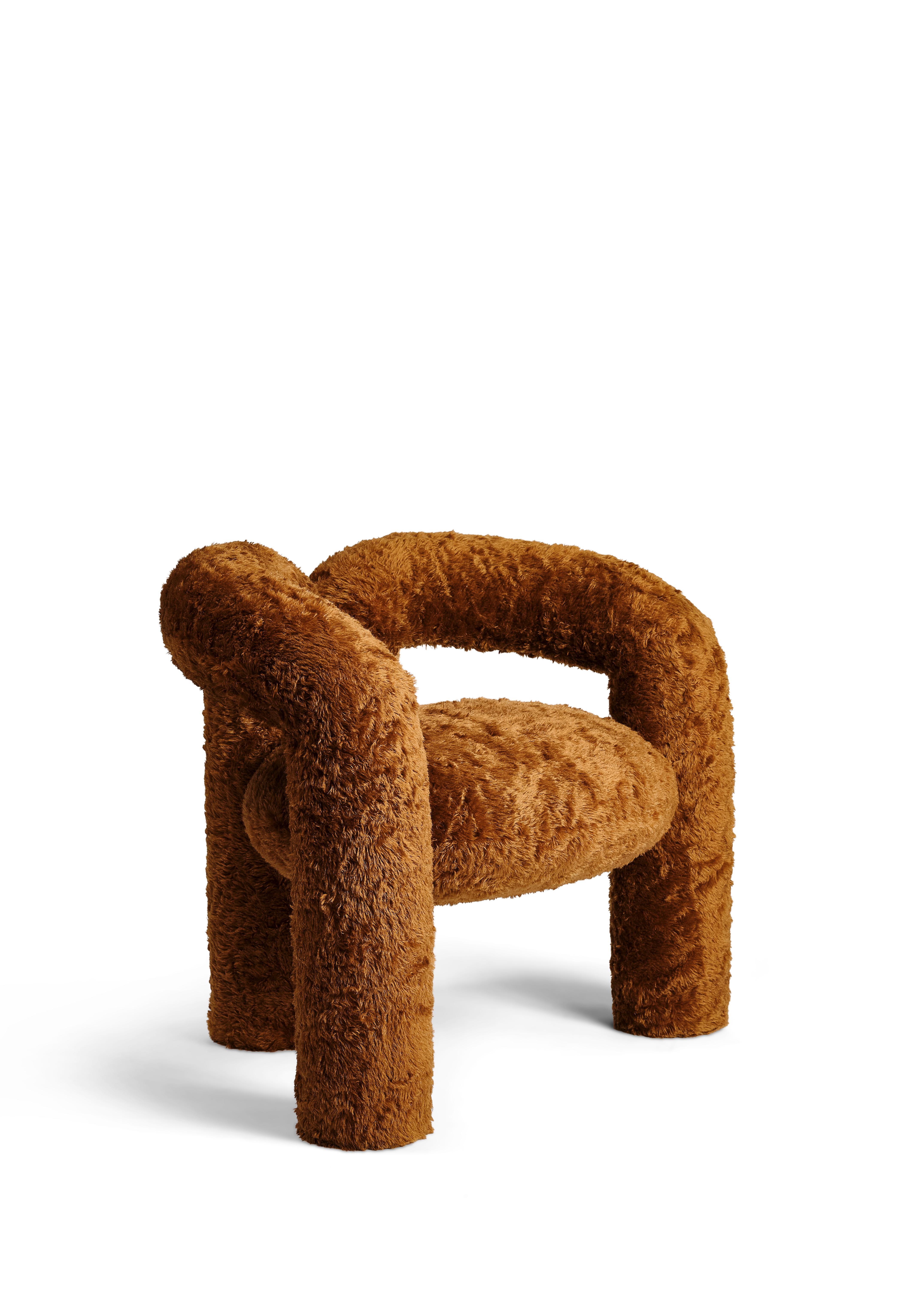 The Teddy chair is our first official seating piece. The upholstered, tubular legs contour up and around the seat cushion, transitioning from leg, to arm, to back support before returning to the floor as legs again. The steel frame’s curves are