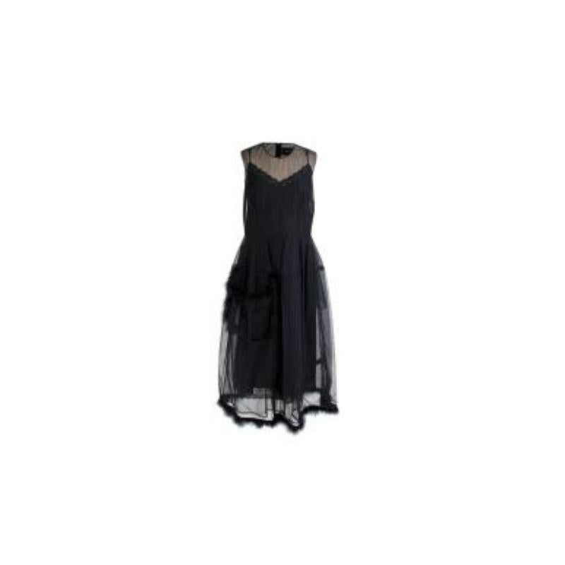 Simone Rocha Feather Trimmed Black Tulle Dress 
 
 
 
 - Light weight black tulle body 
 
 - Feather trim details 
 
 - Large tulle flap pocket
 
 - Sleeveless 
 
 - Back zip fastening
 
 - Black silk slip dress with lace trim 
 
 
 
 Material:
 
