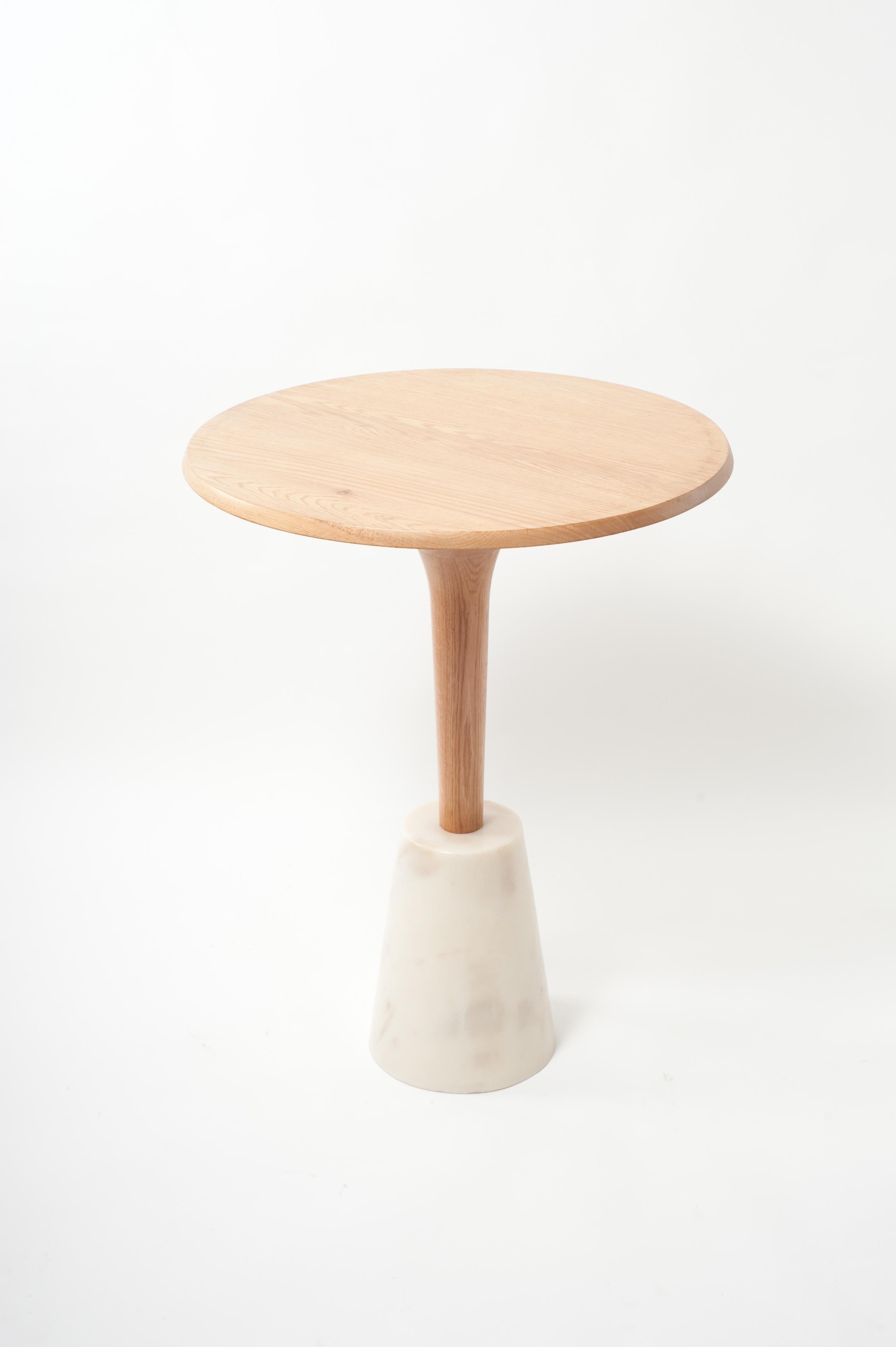 This Scandinavian-influenced occasional table is available in White Oak with a Purple White marble base. 

Founded in 2011, AKMD developed out of a thirteen-year friendship and design collaboration between Ayush Kasliwal and Mike Dreeben.

The two