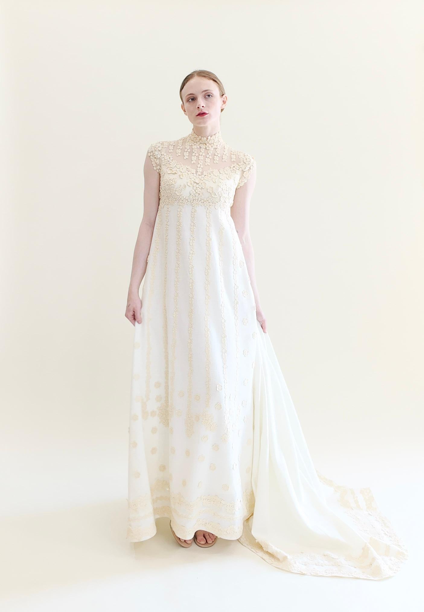 Introducing the elegant Teeny by Priscila of Boston 1970's Gown. This vintage piece boasts intricate imported cotton and lace details, with a stunning train. As a designer for celebrities like Grace Kelly and political figures like Barbara