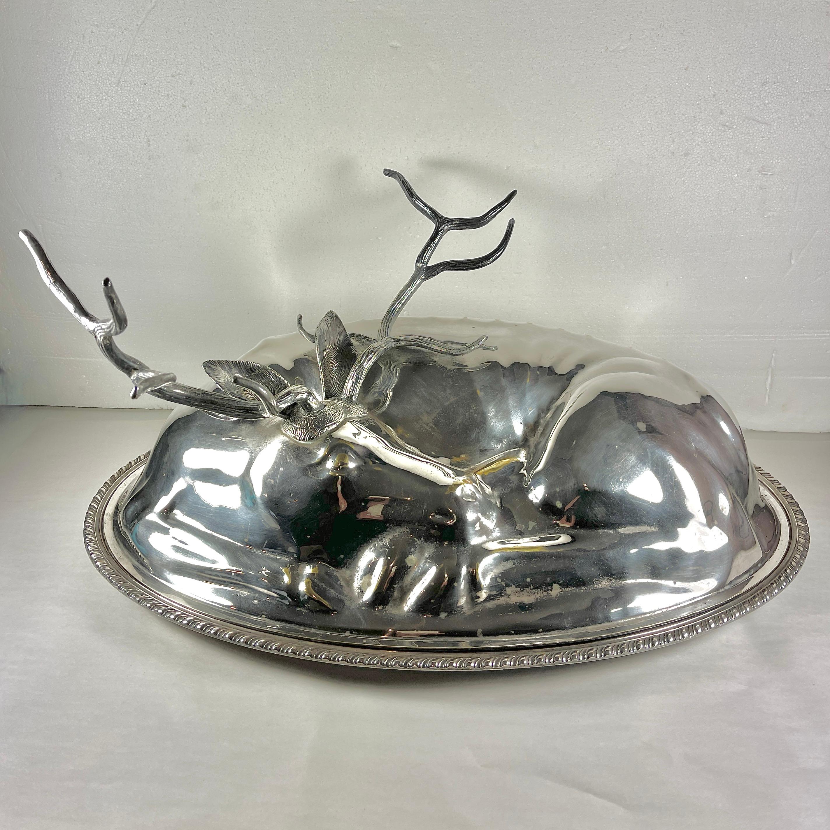 From Teghini Firenze of Florence, Italy, a monumental Mid-Century era, silver plated figural resting Stag covered serving platter, circa 1970s.

Fonderia D’Arte Teghini, Firenze, produced sophisticated, high quality hand crafted items with limited
