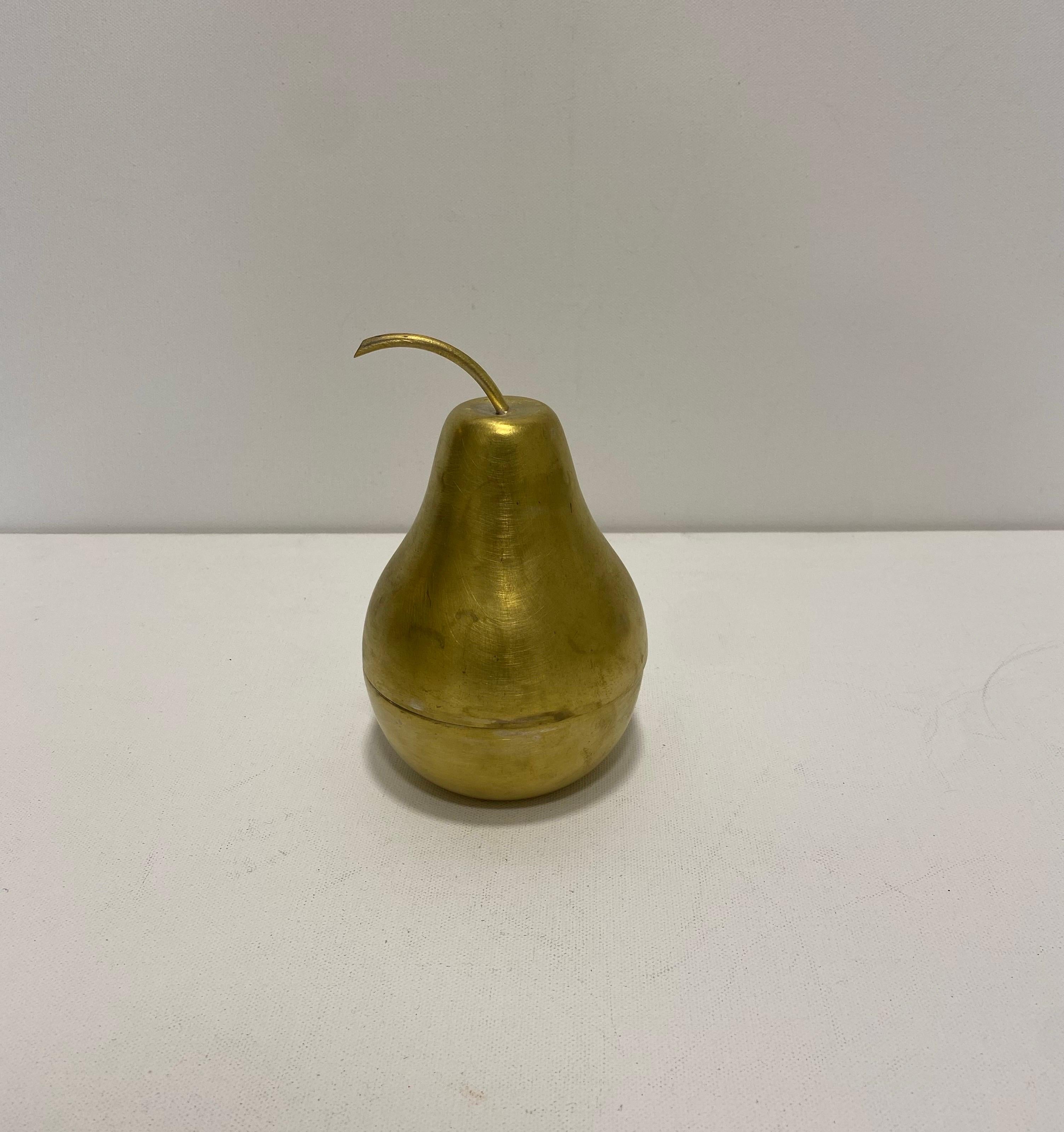 This is a small, pear-shaped ice bucket from the 1960s by Teghini Firenze, a renowned Italian metalwork company known for its elegant mid-century designs. 

The ice bucket is made of aluminium steel and brushed brass outer finish with a smooth,