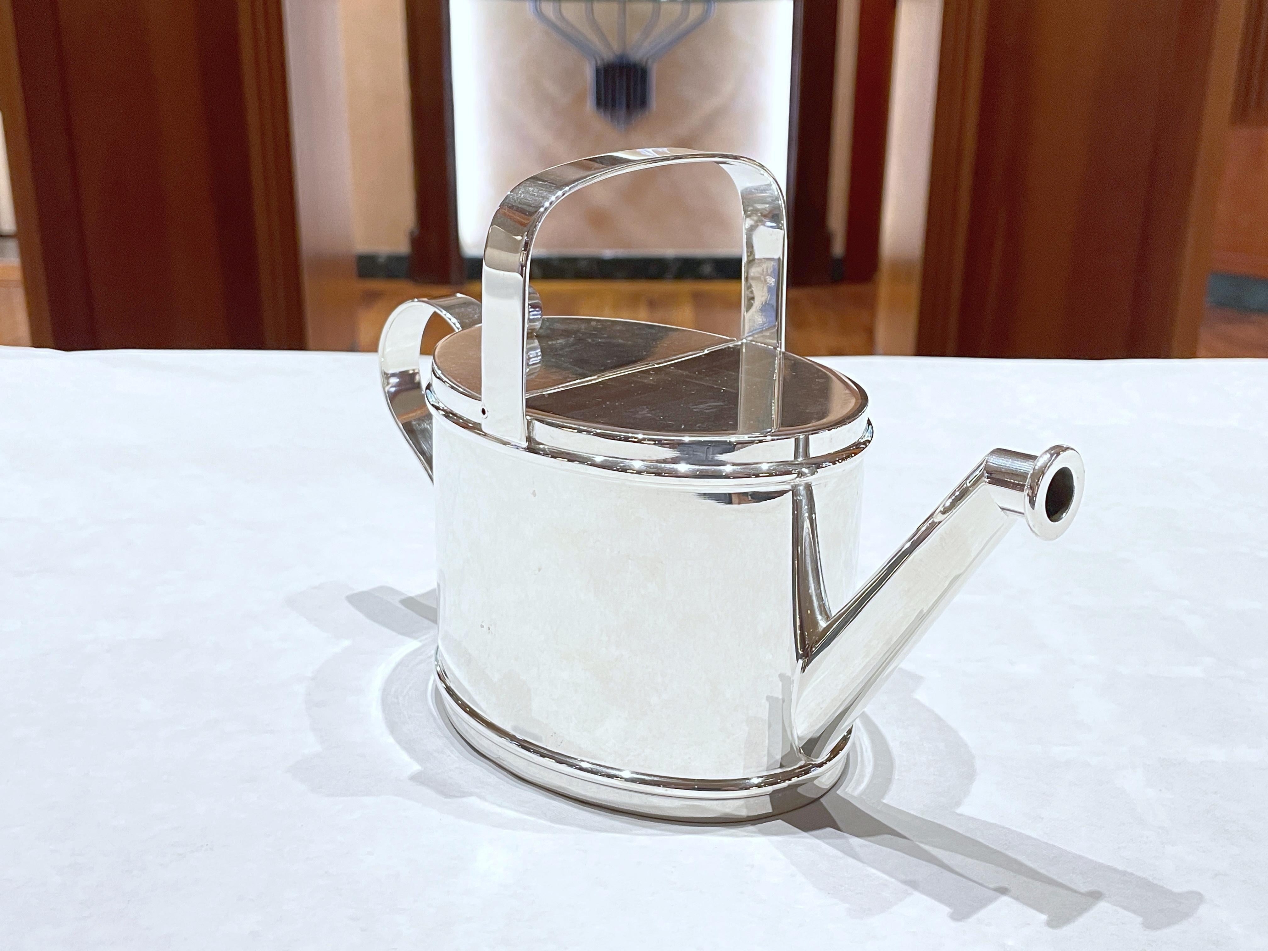 Watering can-shaped teapot in 800/ooo silver , weight 495 g. 
Width cm 9 
Length 22 cm
Height 15 cm
Made in Italy and handcrafted. 

Original Italian-made teapot, from an artisan workshop in Florence.
Sturdy construction, fine finishes.

