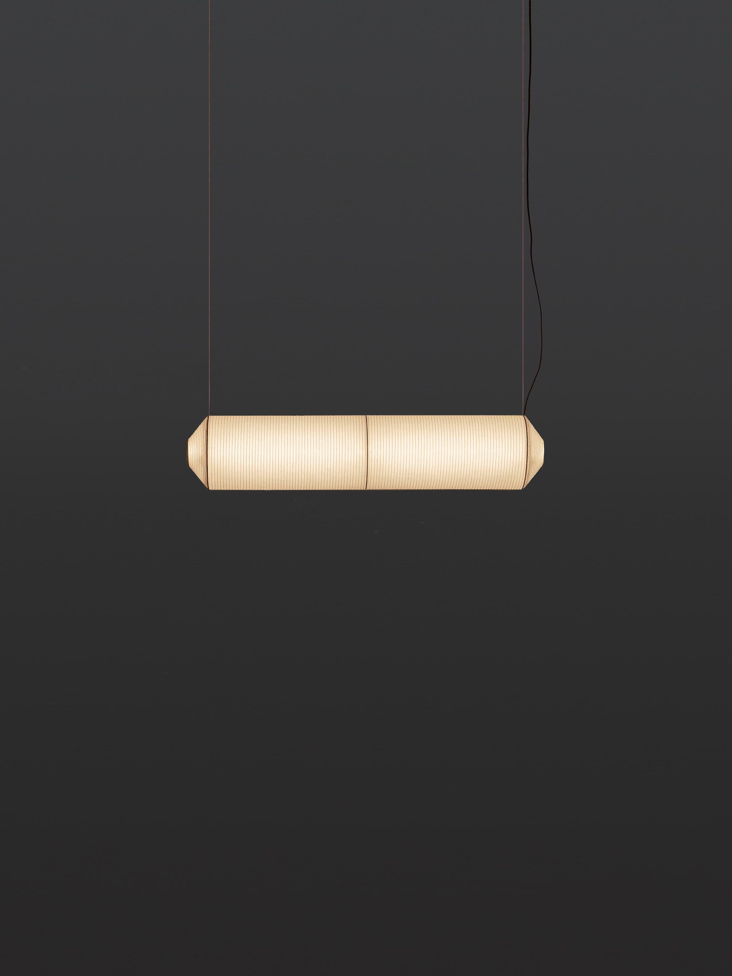 Tekiò Horizontal P2 pendant lamp by Anthony Dickens
Dimensions: D 25 x W 120 x H 25 cm
Materials: Metal, Washi japanese paper shade.
Available in circular or rectangular canopy.

Tekiò, the Japanese word for adaptation, merges ancient artisan