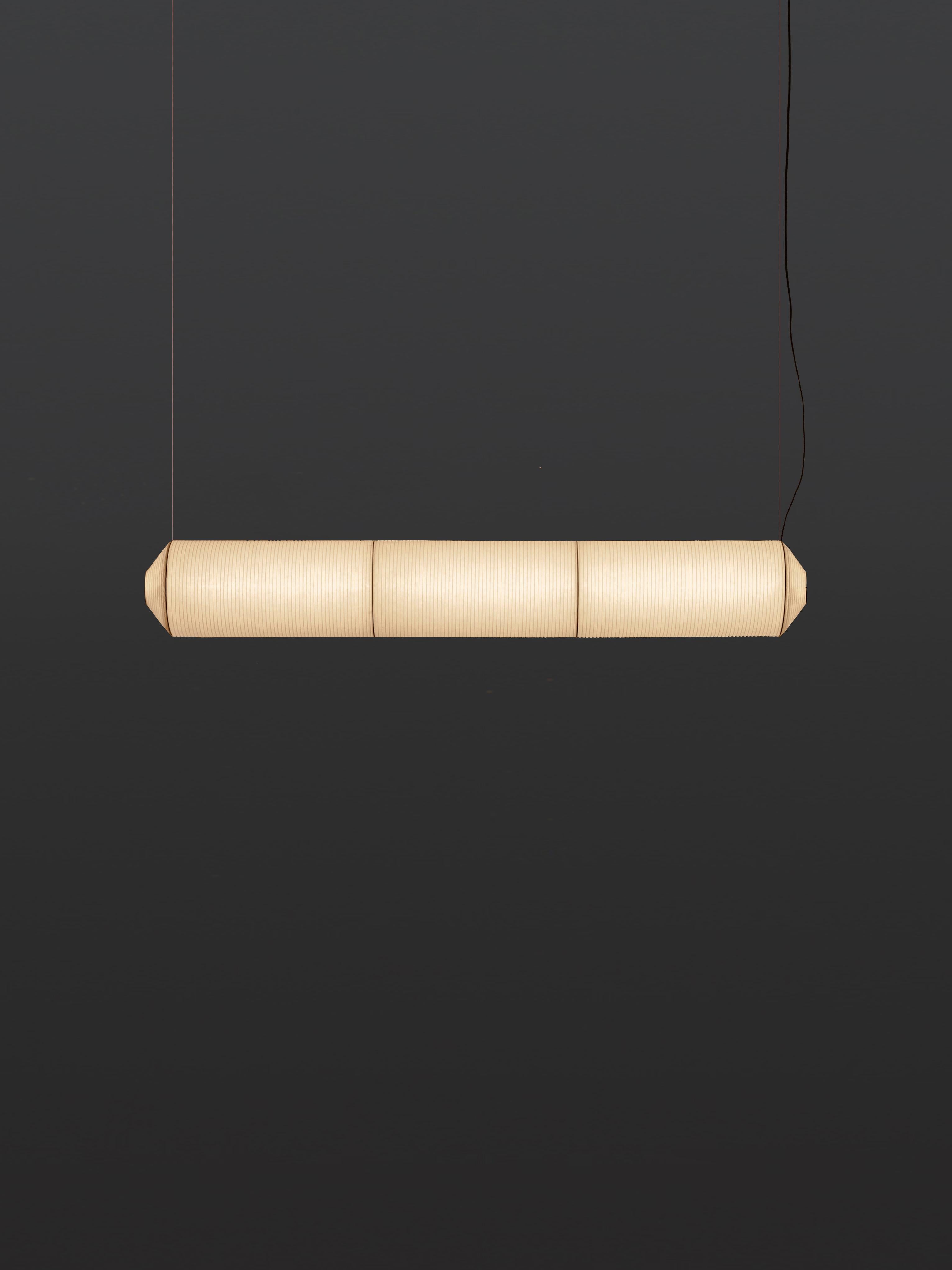 Tekiò Horizontal P3 pendant lamp by Anthony Dickens
Dimensions: D 25 x W 173 x H 25 cm
Materials: Metal, Washi japanese paper shade.
Available in circular or rectangular canopy.

Tekiò, the Japanese word for adaptation, merges ancient artisan