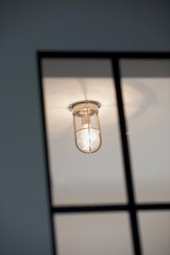 Plafón Tekna Docklight con acabado níquel cepillado y cristal transparente