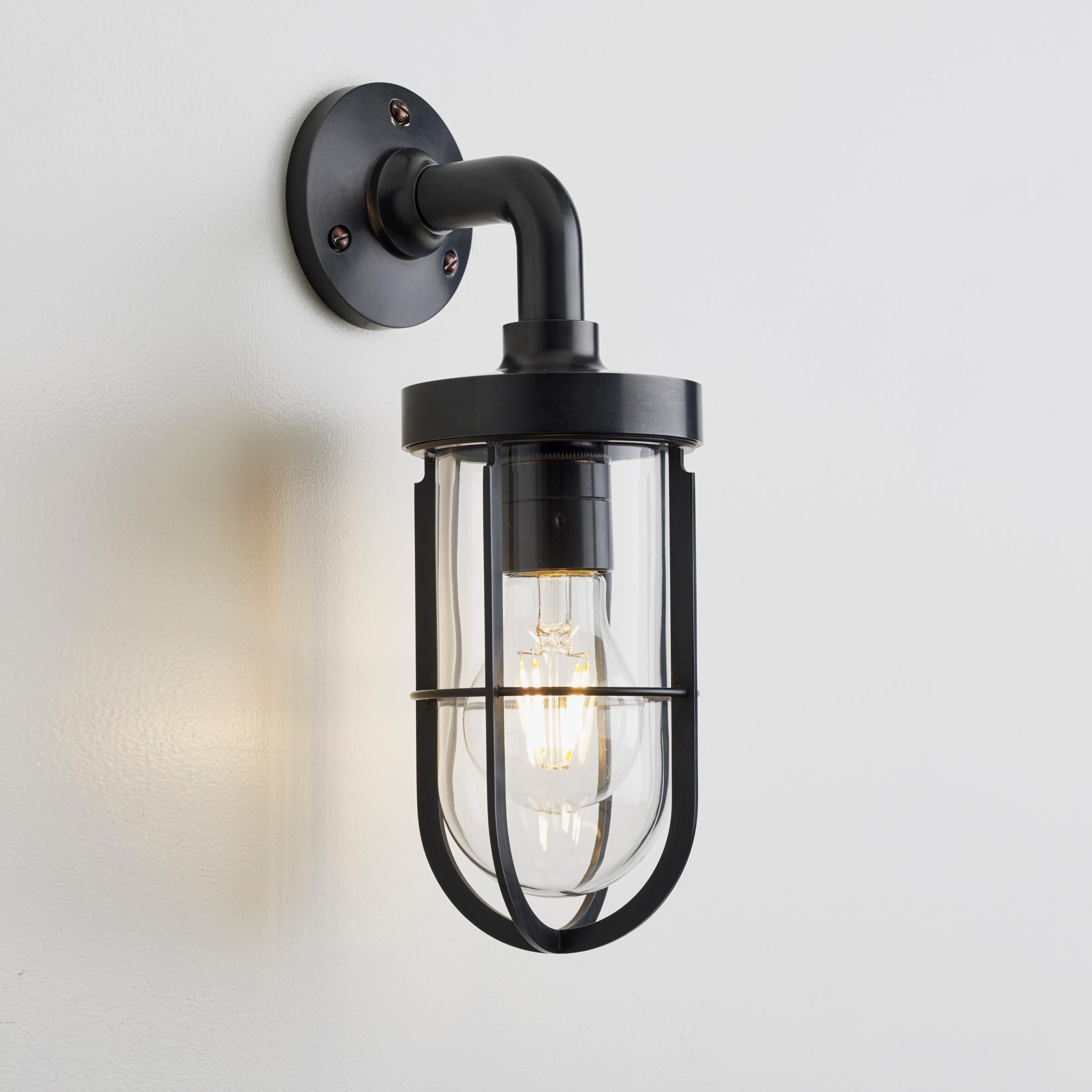 Wall light in solid brass with clear or frosted glass. For indoor and outdoor use (IP44). Note this fixture ships without bulbs which can be sourced from Just bulbs in NYC.

Lamp LED E27 230V 4W 2700K retro A60. Main power 230V 50Hz.