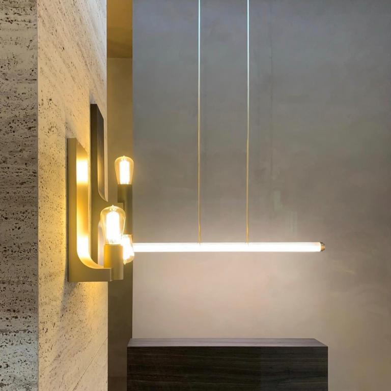 Pendant light in brass with extruded clear glass outer- and frosted glass inner tube.
Dimensions: width 1554mm - height specified by customer - depth 74mm.
Ceiling plate (not included): 550mm x 56mm x 40mm.
LED tube - 24V - 55W - 2700K / 3000K -