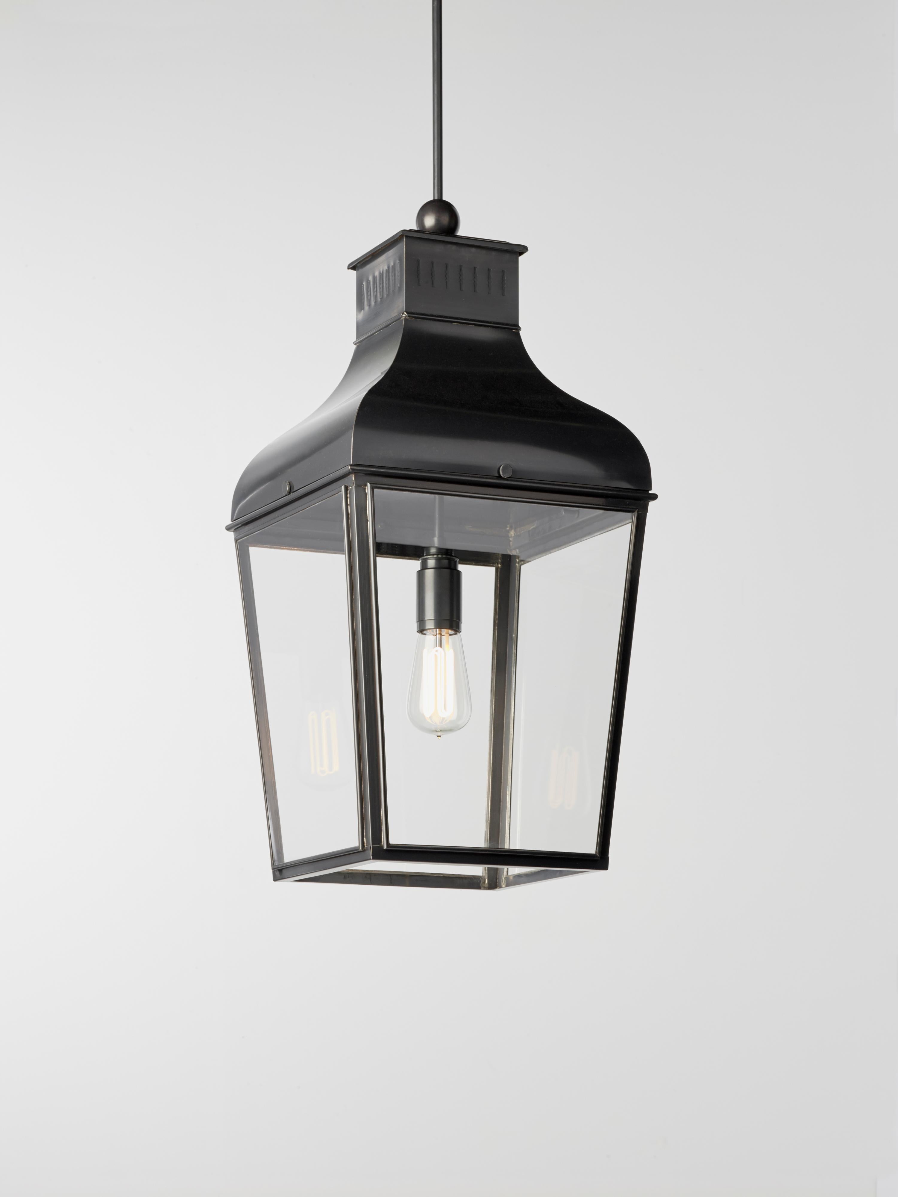 Hanging light in dark bronze with pagoda structure, closed top, outside fitted clear glass. For indoor and outdoor use (IP43). For suspension please inquire regarding additional accessories. 

Light source by ‘Flatspot 2’ downlighter with LED