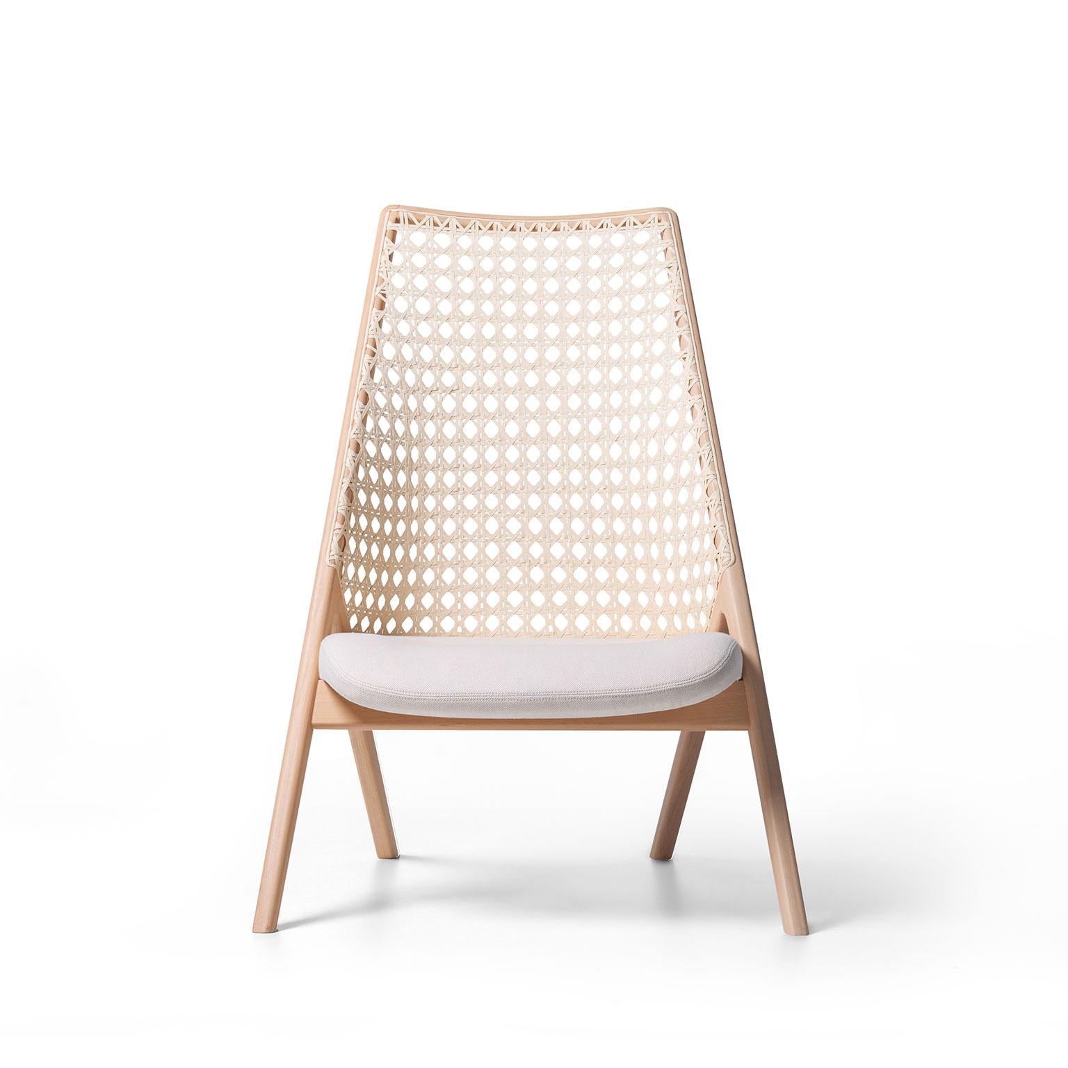 Tela lounge chair is a fusion of contemporary design and traditional Brazilian materials. The backrest weave is inspired by the Classic cane woven pattern of the midcentury furniture. It was recreated in a larger scale and made with cotton thread