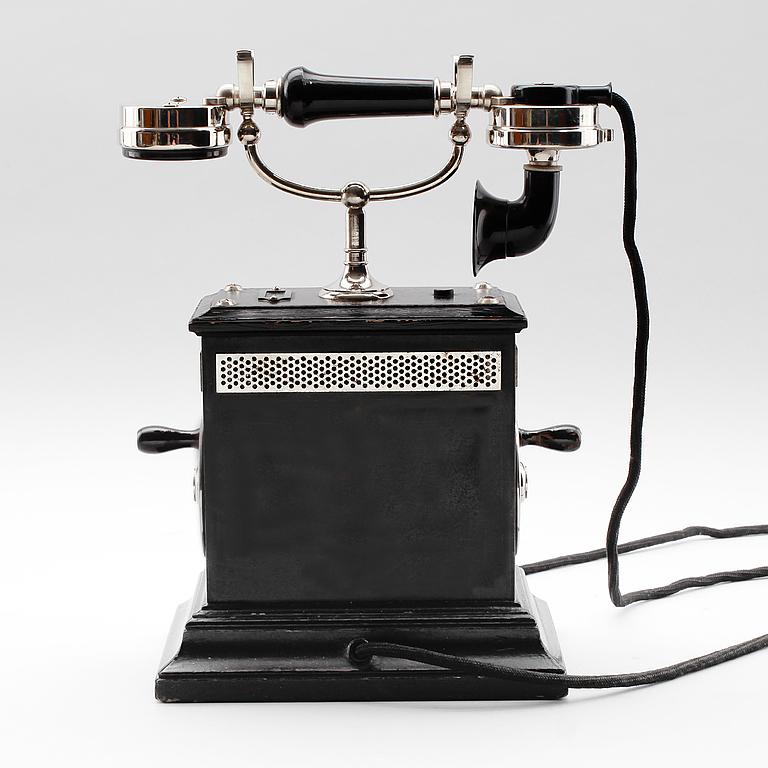 Vintage desk telephone Telegrafverkets Verkstad Stockholm model AB 112 circa 1910.

It is an original early 20th-century object made of black lacquered wood with metal details. Crank winding.

A few minor flaws in the glaze that do not detract from