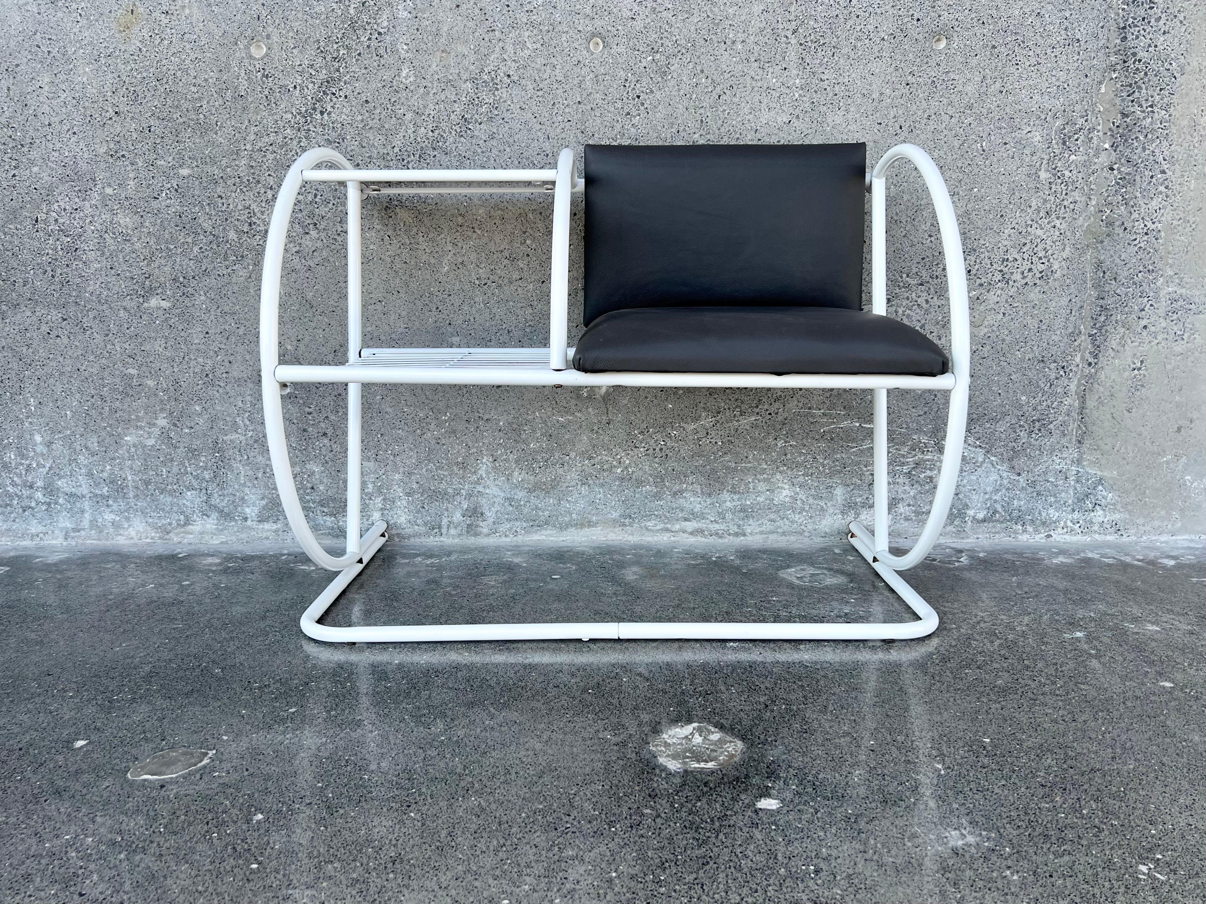 For your consideration Bauhaus style tubular telephone table, seat upholstered in genuine leather, original smoked glass, the piece was completely restored, painted white and new leather on the seat and backrest. for more photos or video upon request