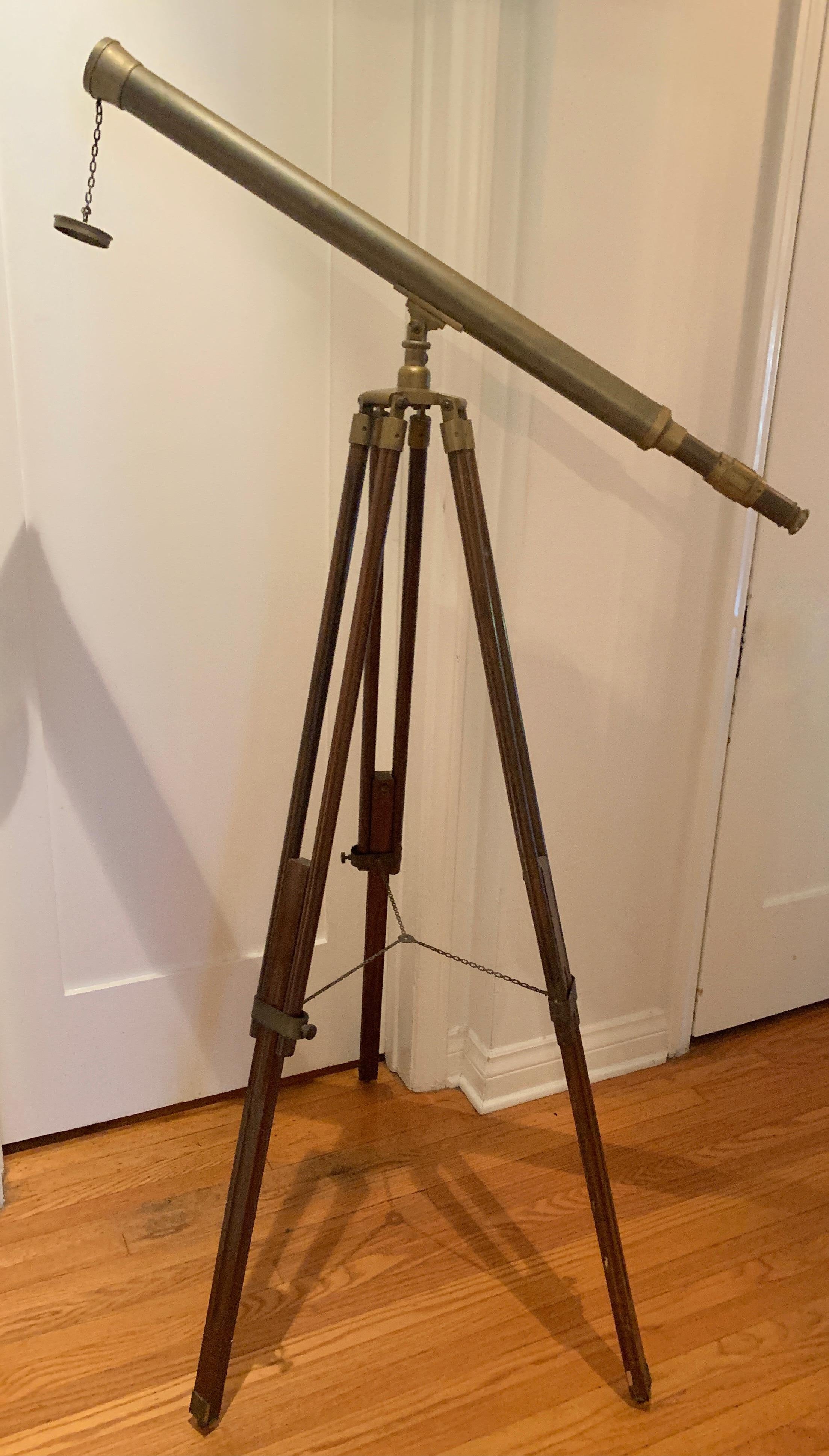 Telescopes are a terrific decorative addition to any den, library or study. A compliment to any Ralph Lauren, rustic or studious environment, ours has all wooden adjustable legs with Solid Patinated brass fittings and hardware. The piece is for