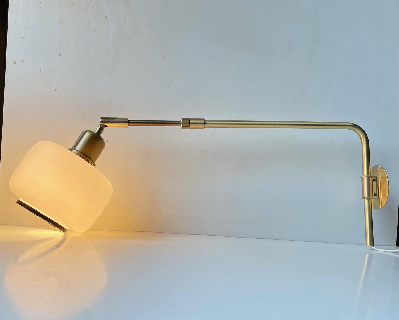 This fully adjustable telescopic wall swing light has a mechanism that allows you to adjust its reach from 45 to 78 cm from the wall. The residue of its old paper makers mark indicates that it was made by either Lyskær or Lyfa. during the 1970s or