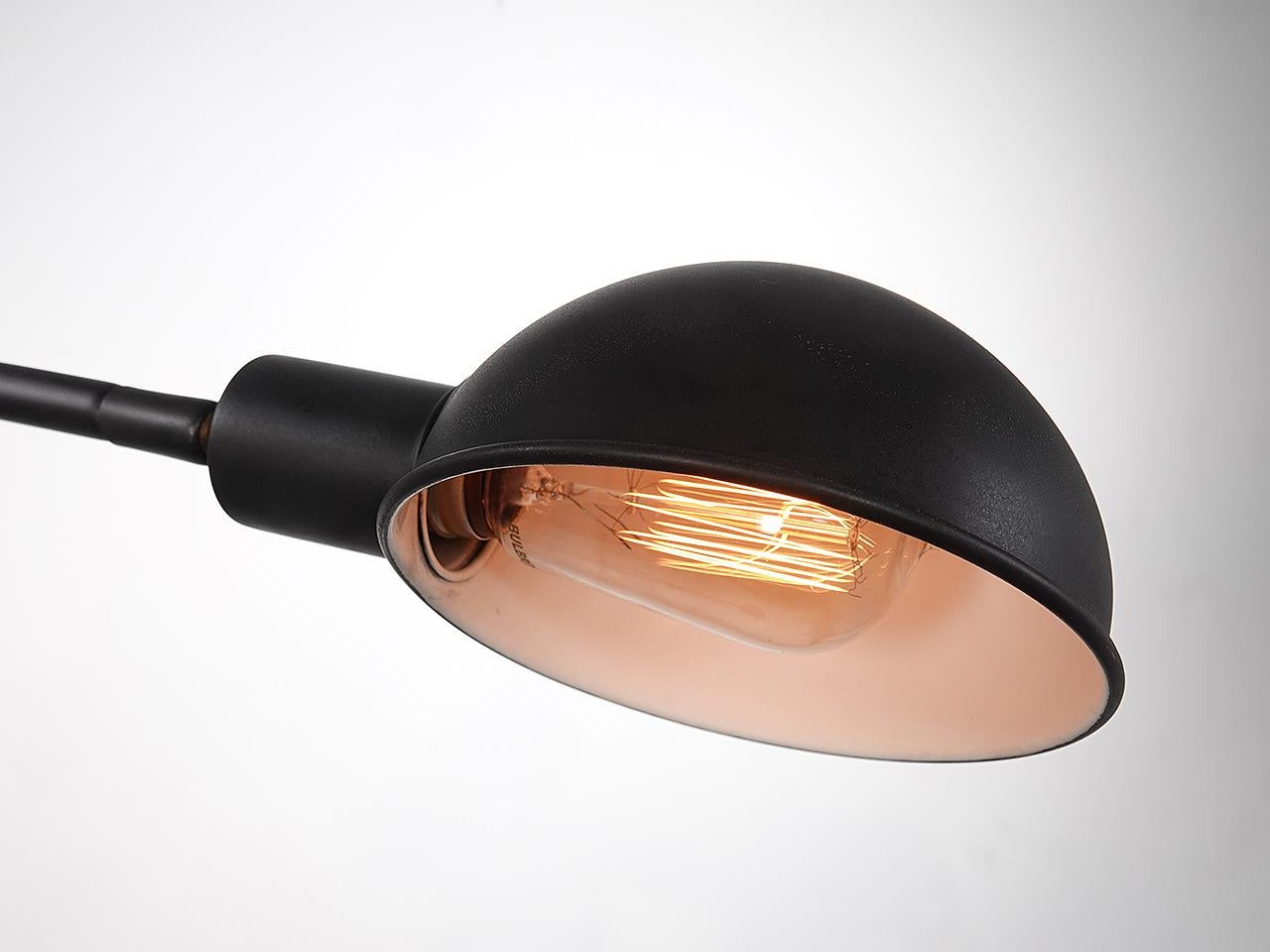 This is a nice simple example of a Pharmacy style lamp. The base is heavy with an 10 inch diameter. The vertical stand is topped with an easy to use telescoping pipe raising and lowering the shade. The brass shade is a half dome and the E26 socket.