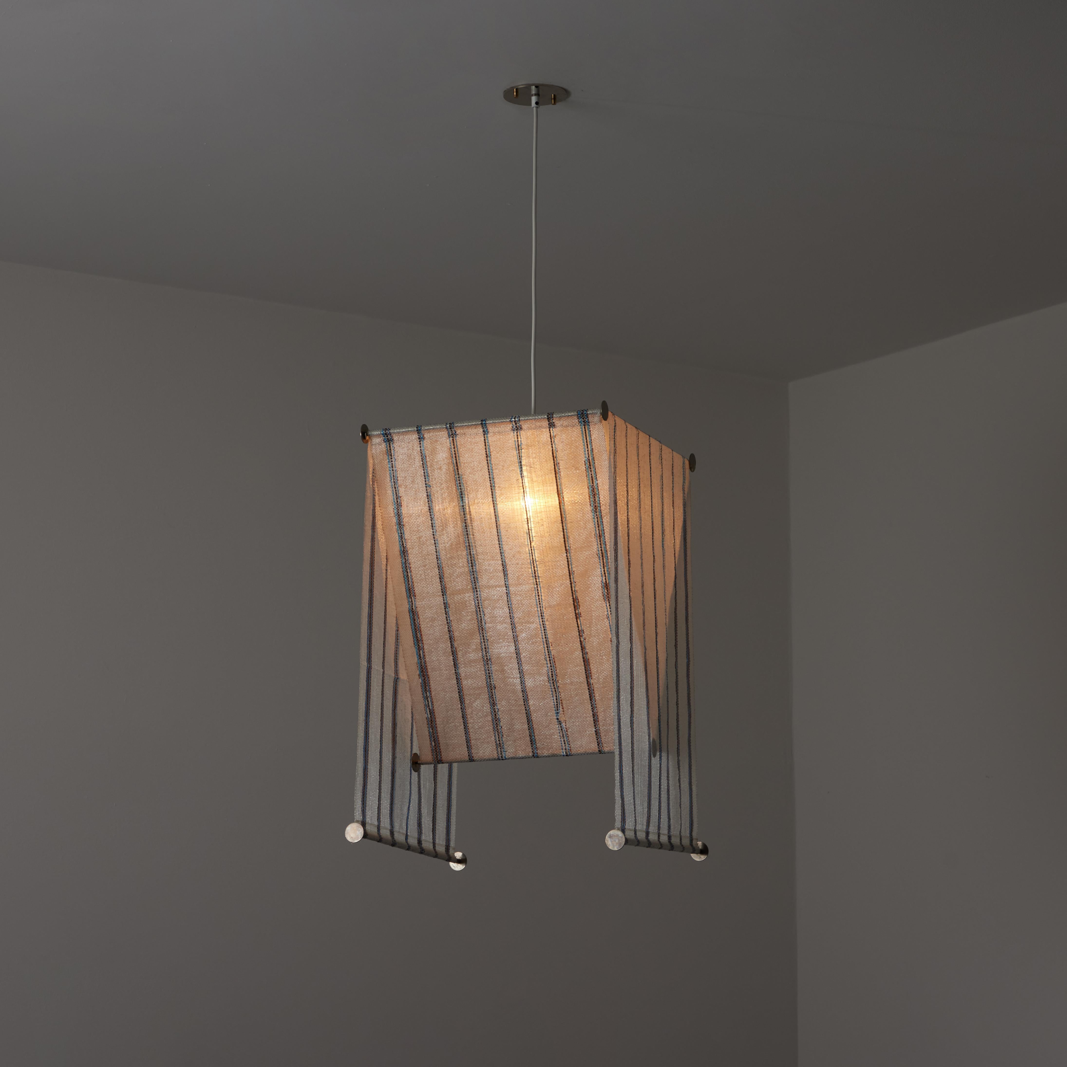 Kd51/R  'Teli' Pendant by Achille and Pier Giacomo Castiglioni for Flos. Designed and manufactured in Italy, circa the 1970s. Original striped version. A contemporary take on geometrical formations take the lead on this design. Two weighted Raylon