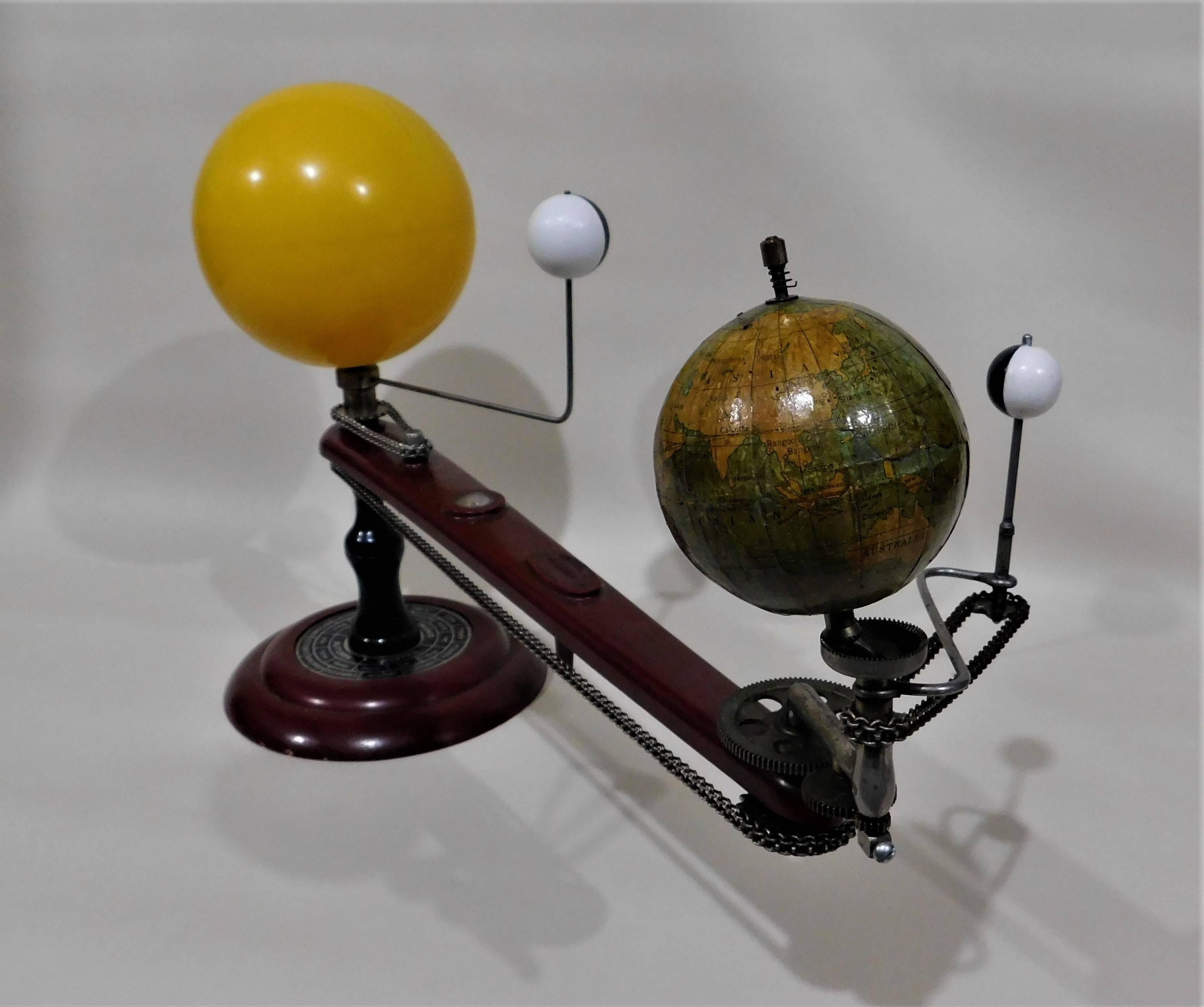 A geared tellurian by Trippensee Planetarium Co. Saginaw Michigan, is a demonstration model of the movement of the Earth, Moon and Venus relative to each other and to the sun. It shows such phenomena as the succession of seasons, and solar and lunar
