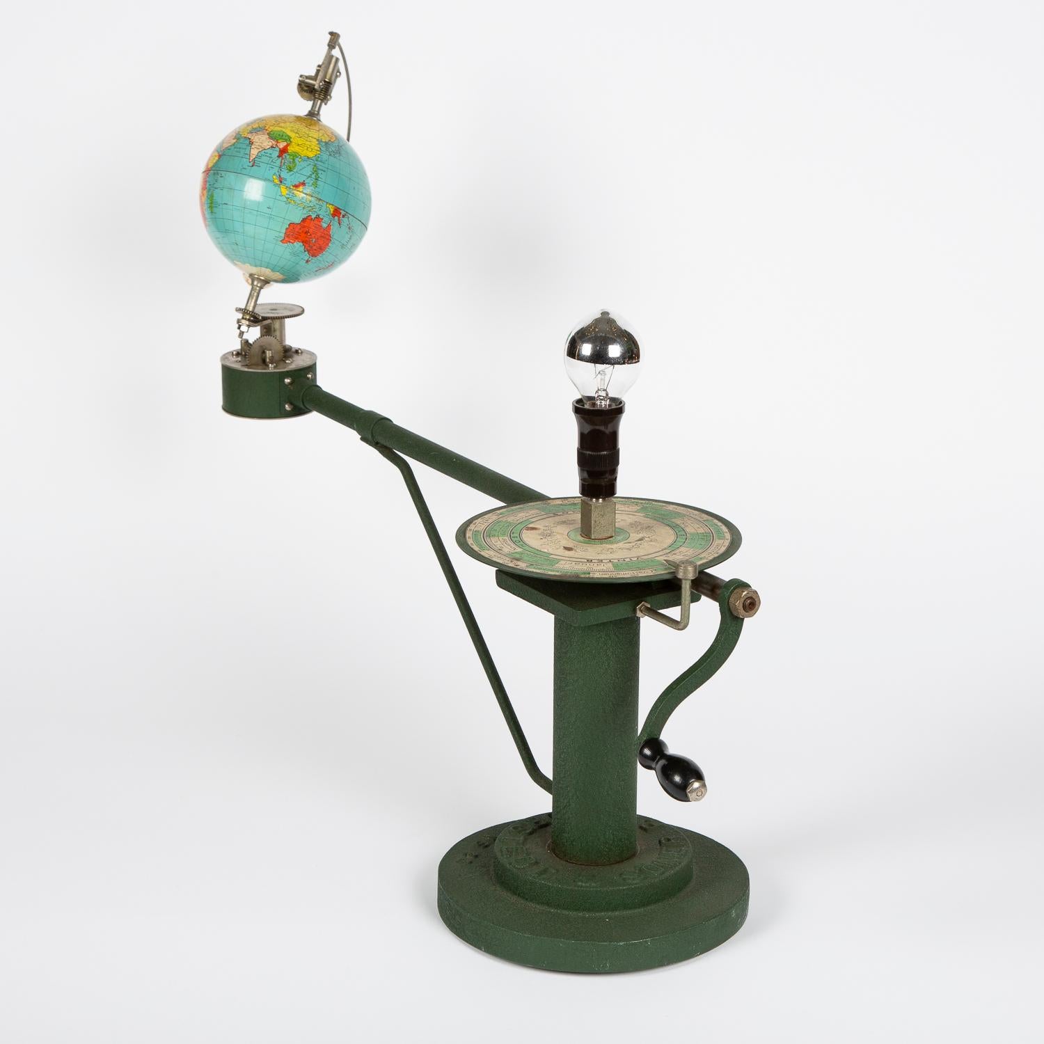 A 1930s tellurium by P. A. Norstedt & Söner of Stockholm, Sweden.

The tellurium has a hand-cranked mechanism with a globe of the Earth and Moon revolving around a central light representing the sun, the light is above circular disc printed with