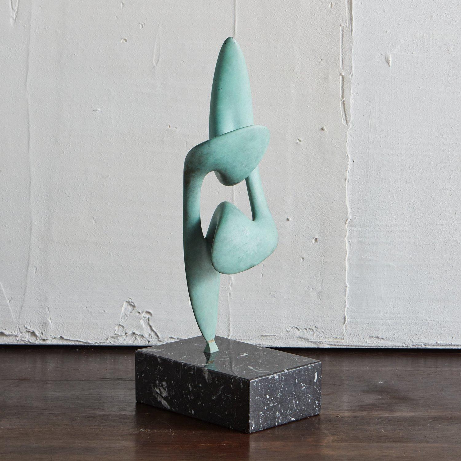 The Telomere twist sculpture by Chicago artist Karl Geckler. Featured here in Verde Gris finish and mounted on a polished black marble base.

This piece is available standard in a Satin Bronze Finish for $3,120, with a Polished Black Granite or