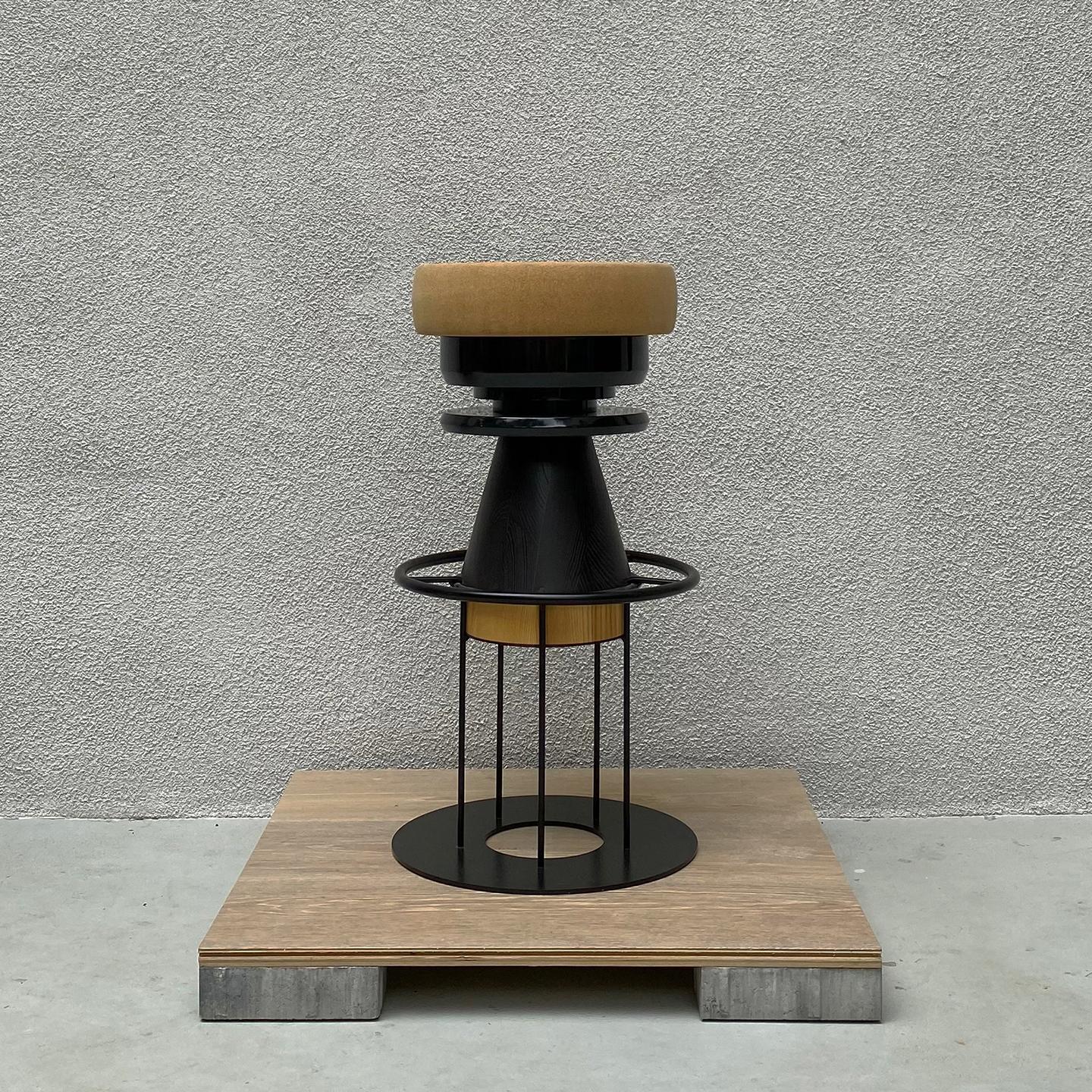 Tembo is a sculptural stool that combines a wood metal body with a solid cork seat. The designers drew their inspiration both from the African tam-tams -Tembo means elephant coot in swahili- and give a nod to the Memphis group of the 80s aesthetics.