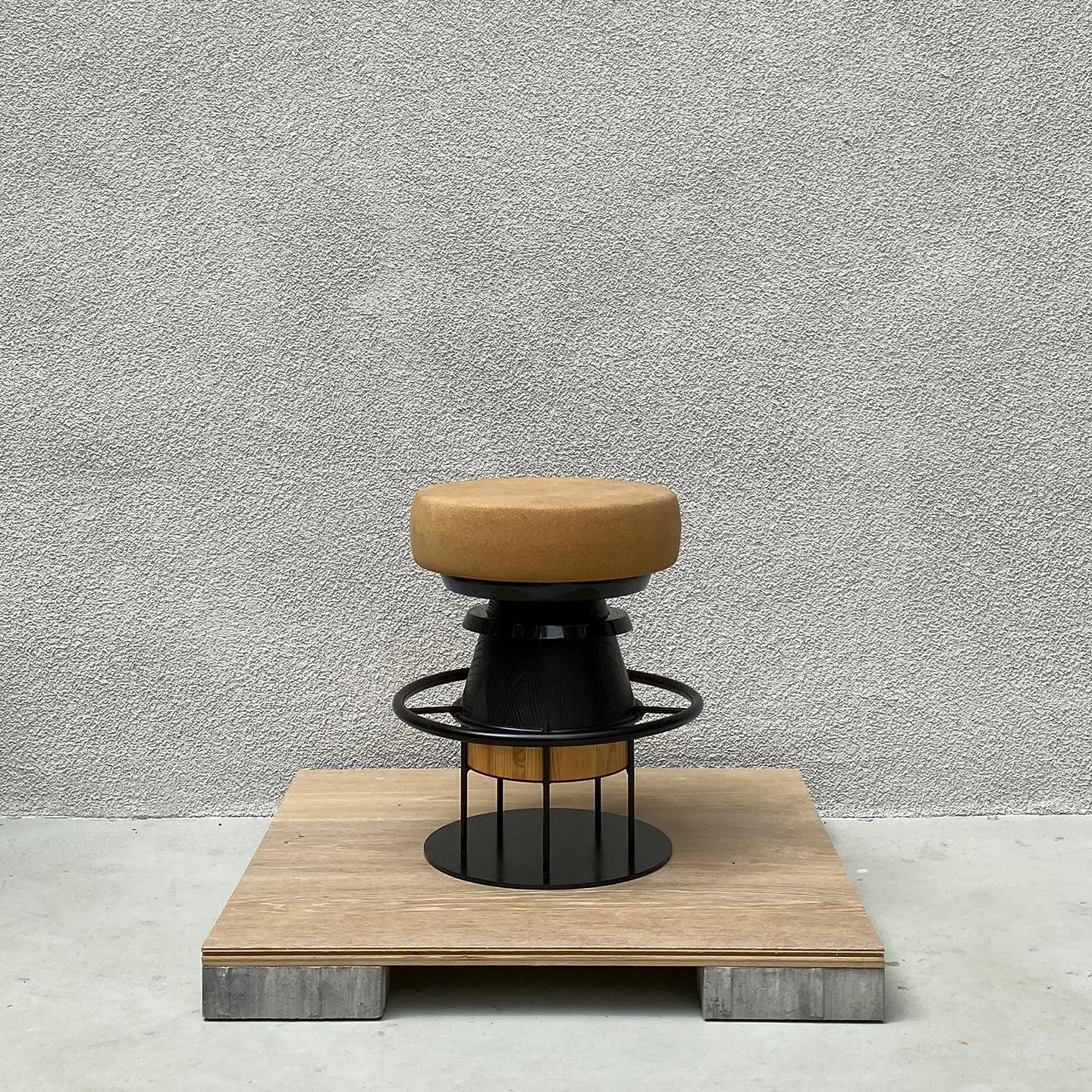 Tembo is a sculptural stool that combines a wood metal body with a solid cork seat. The designers drew their inspiration both from the African tam-tams -Tembo means elephant coot in swahili- and give a nod to the Memphis Group of the 80s aesthetics.