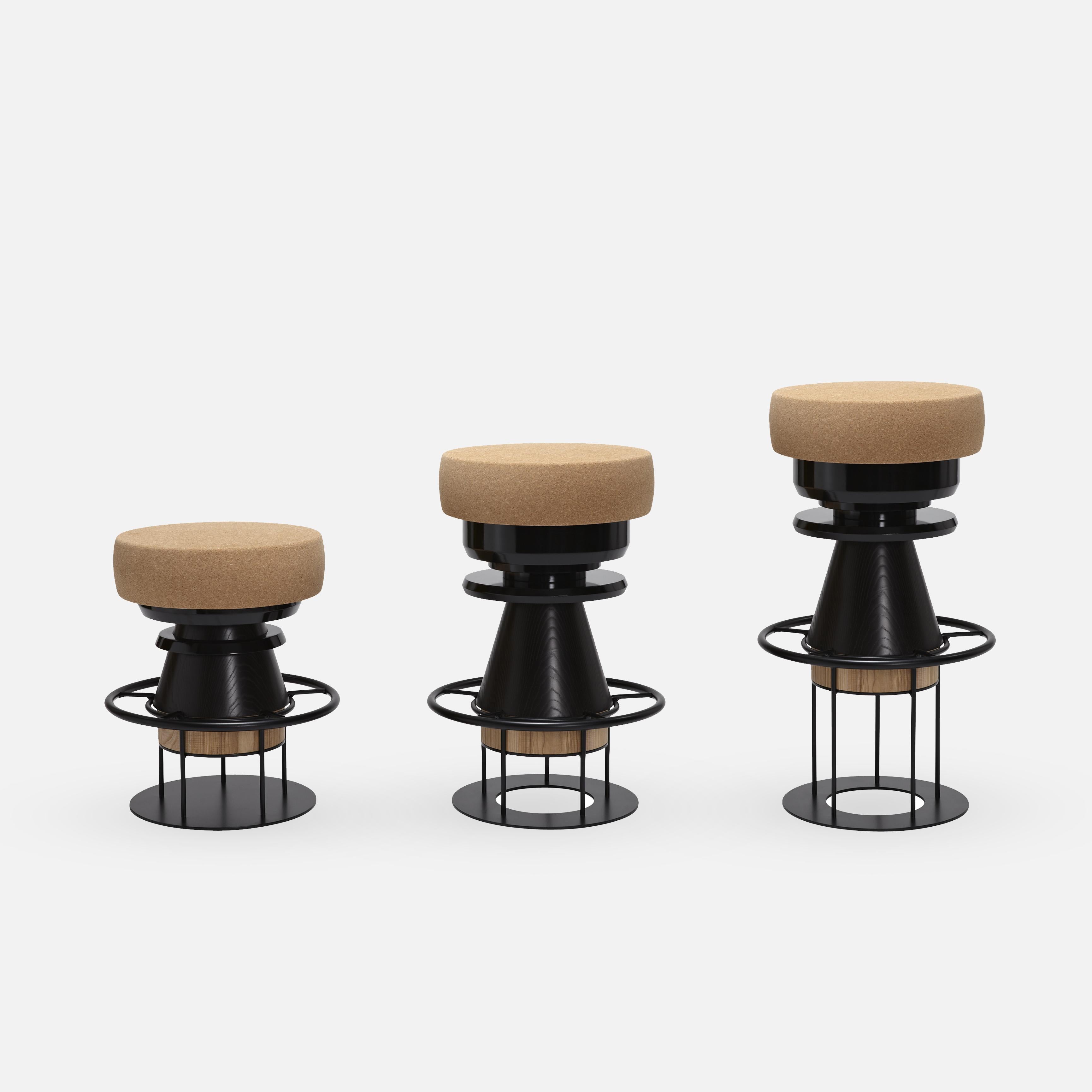 Tembo is a sculptural stool that combines a wood metal body with a solid cork seat. The designers drew their inspiration both from the African tam-tams -Tembo means elephant coot in swahili- and give a nod to the Memphis group of the 80s