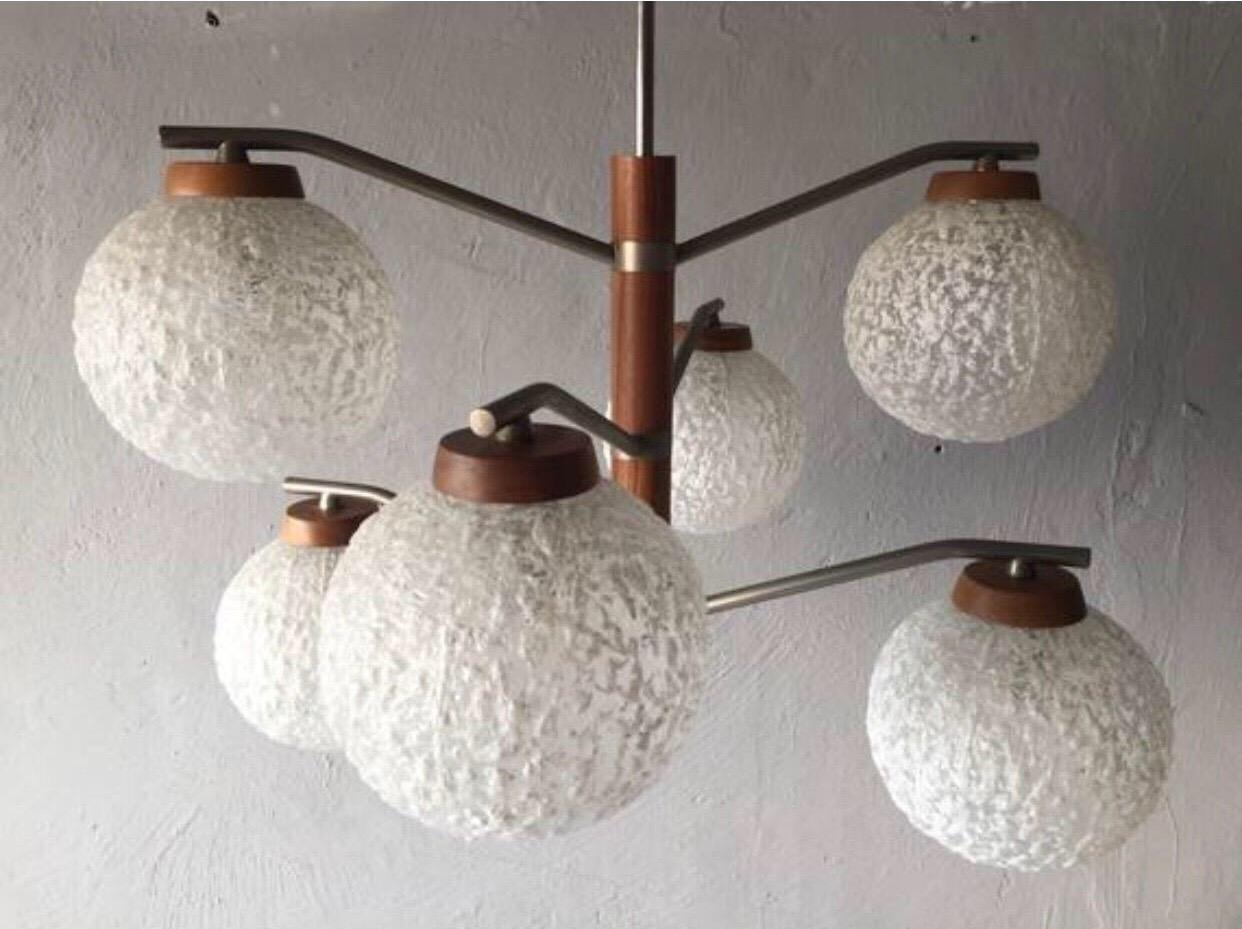Manufacturer brand: Temde, 1960s, Germany
Type 564
This Fantastic designed chandelier made of globe glass crinkly lampshades, teak body and matte metal arms. Arms can be rotated. 
Works with E27 type of bulbs.