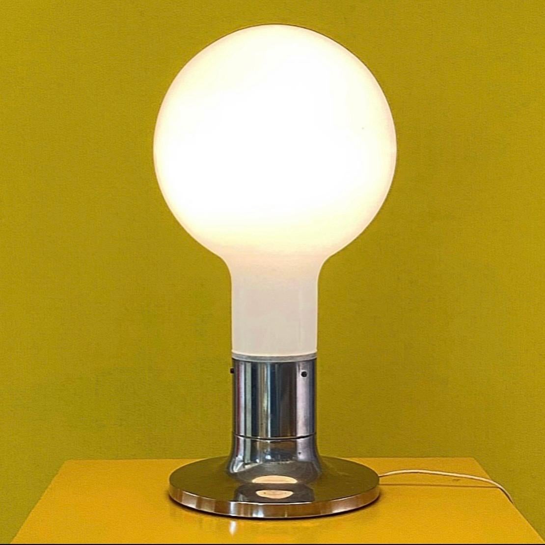 Thick milky white opaline glass lamp with a base of chrome plated metal base produced by Temde, Switzerland 1970s.

It’s super special and quite famous since it was used in the 1970s movie called “A clockwork orange”. 

Shape like a ball, huge