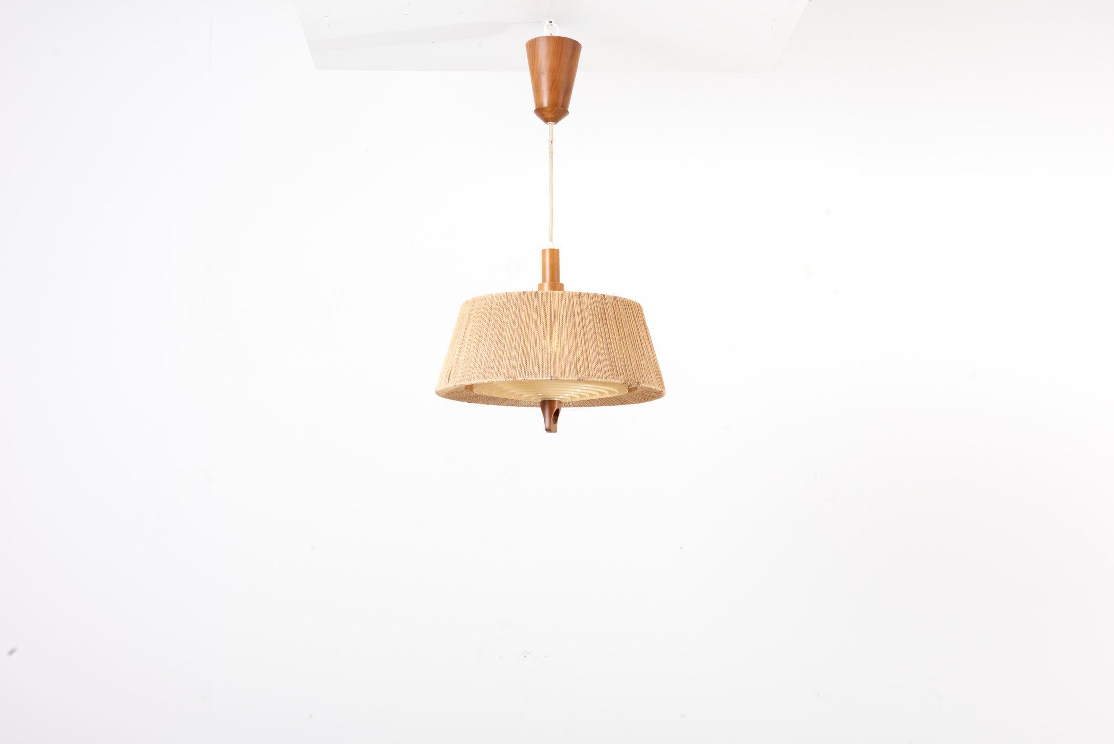 Temde Teak and Sisal pendant lamp, Switzerland 1950s. The height given applies to the shade. This Lamp has a height adjustment system in its canopy. The perspex diffuser is in excellent condition and the teak detail on the shade is very special and