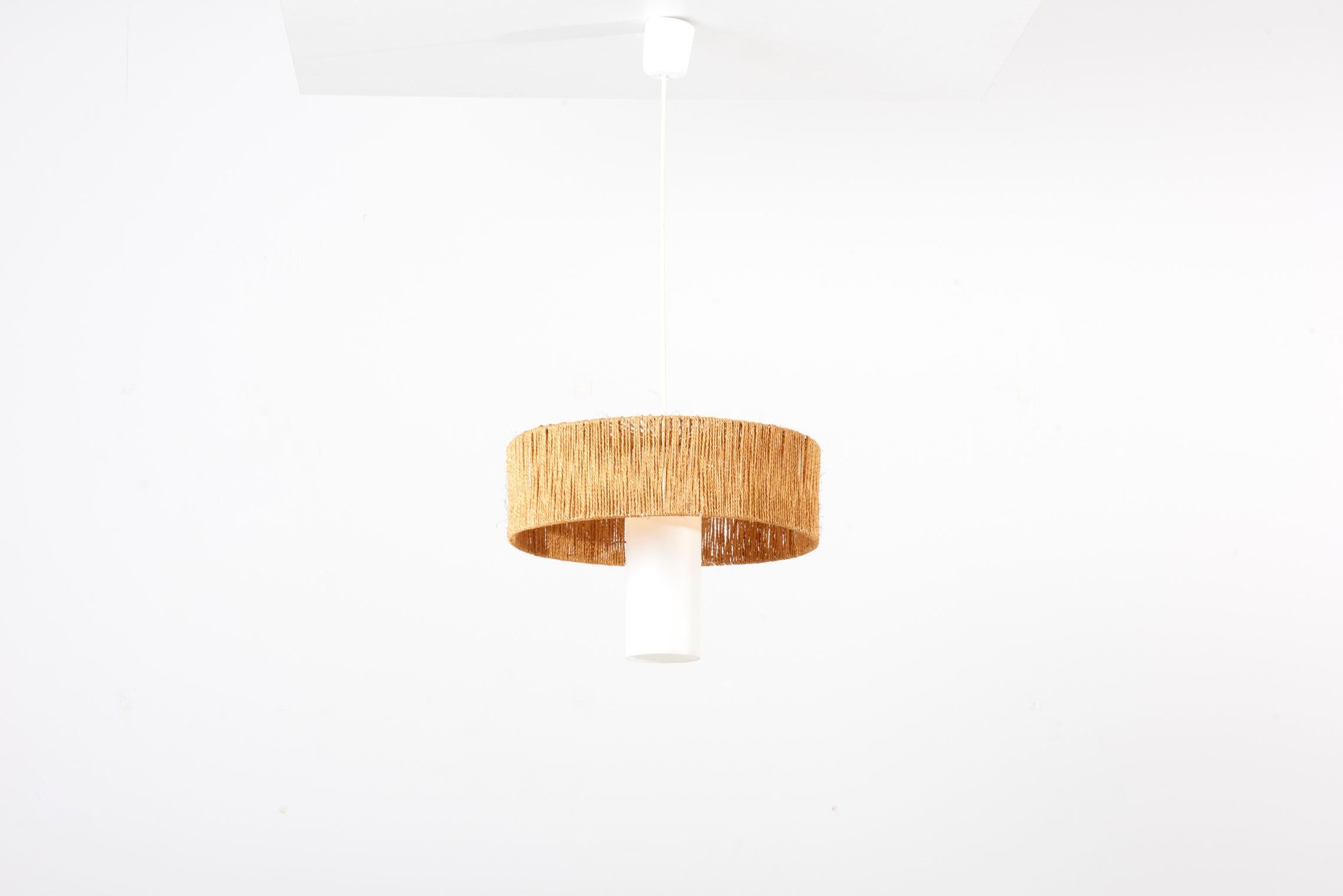 Temde Teak and Sisal pendant lamp, Switzerland 1950s. This Lamp has a glass cylinder as a diffuser and is in very good condition. The height given applies to the sisal shade including the glass cylinder. 