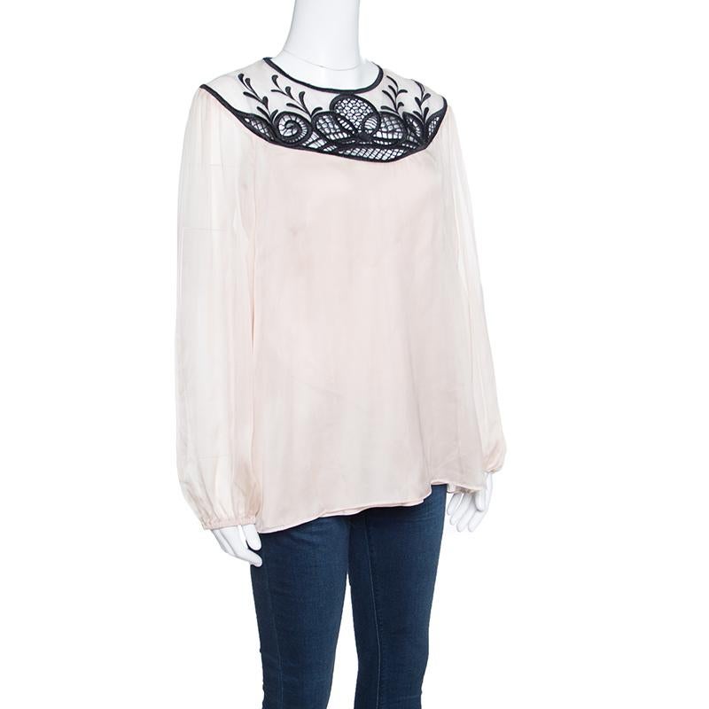 Every once in a while you need to make a statement and look ethereal and what better an option than this dazzling Maxine blouse from Temperley London. Enchanting in a lovely beige shade, the blouse is made of 100% silk and looks absolutely stunning